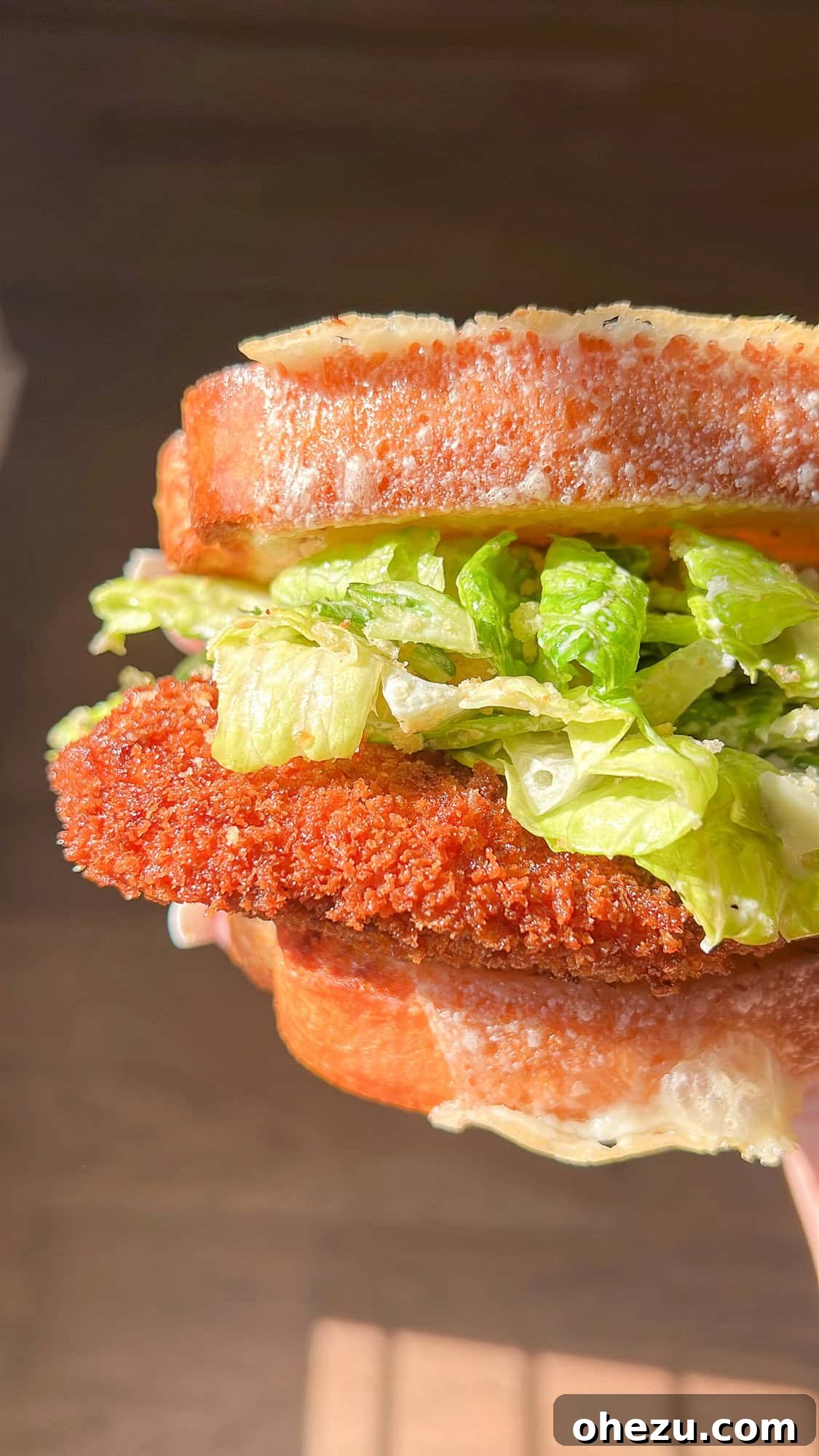 Ultimate Crispy Chicken Caesar Salad Sandwich on a plate