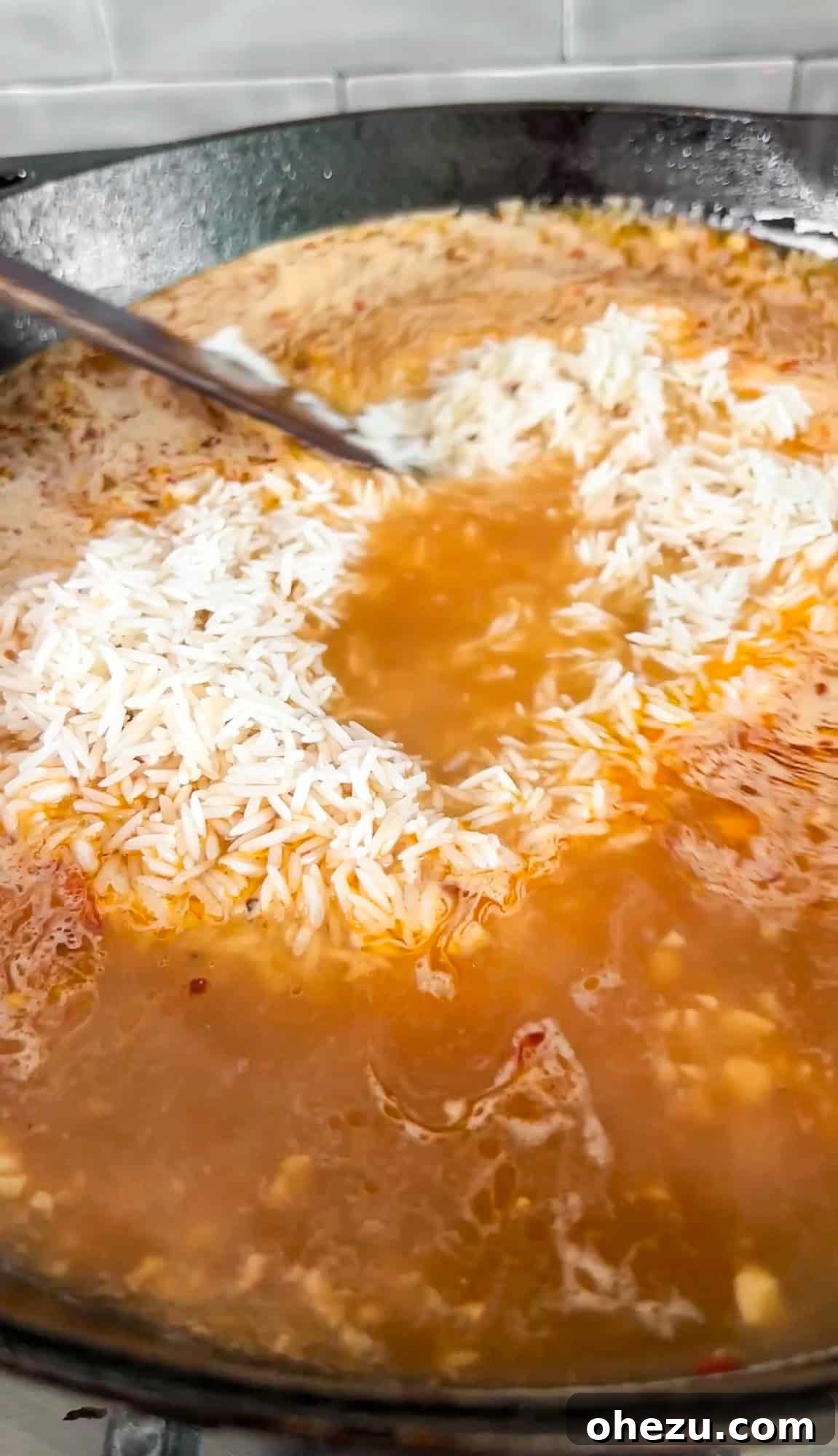 One-Pan Garlic Parmesan Chicken and Rice Skillet with Corn 7 Braising rice in garlic wine sauce