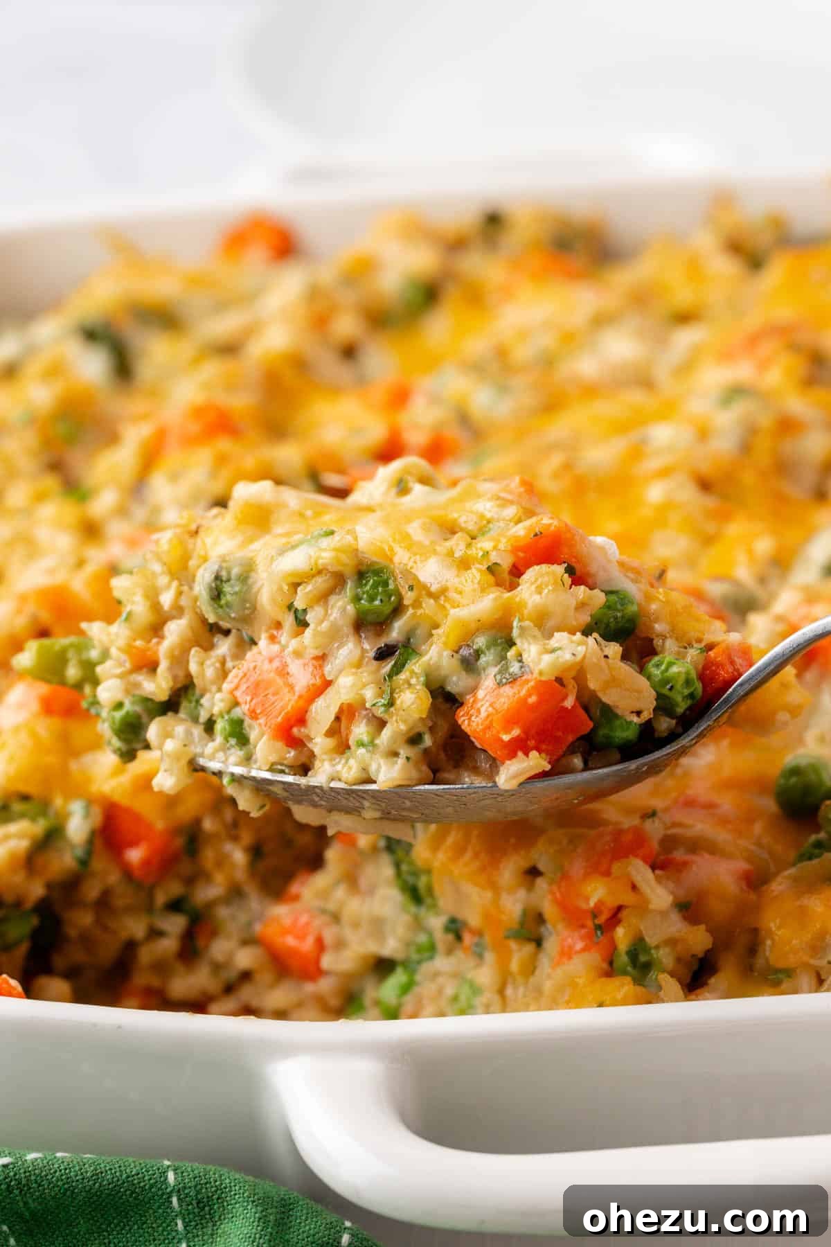 Hearty Vegetable Rice Bake 18 Close-up of the vegetable rice casserole, showing a golden top and creamy interior, ready for serving