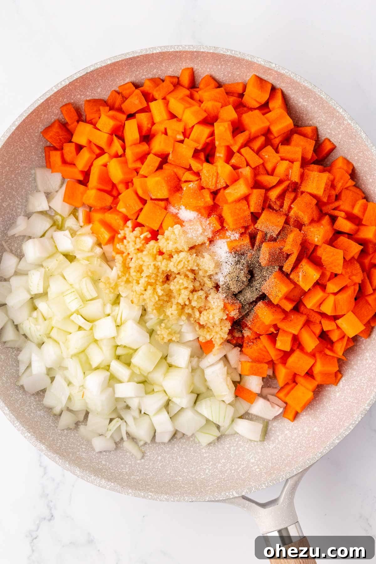 Hearty Vegetable Rice Bake 5 Carrots, onions, garlic, and spices cooking in a large skillet