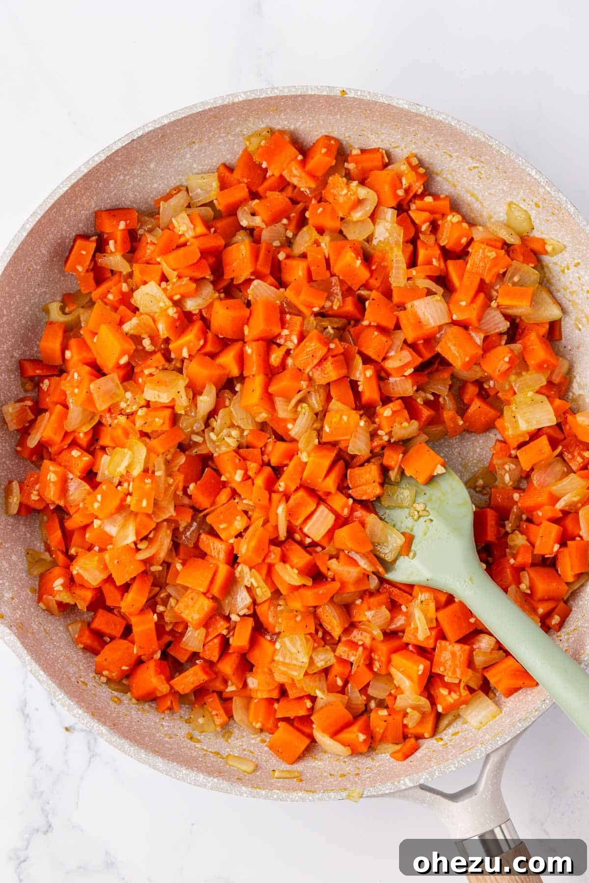 Hearty Vegetable Rice Bake 6 Softened carrots and caramelized onions in a skillet