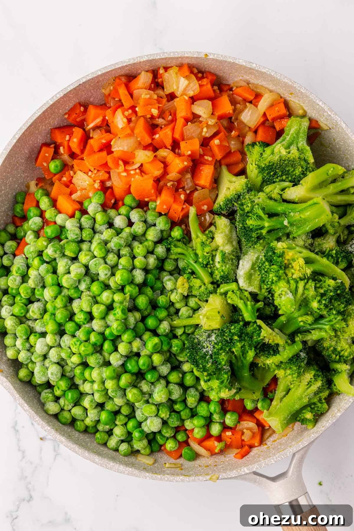 Hearty Vegetable Rice Bake 7 Adding frozen peas and broccoli to the sautéed vegetables