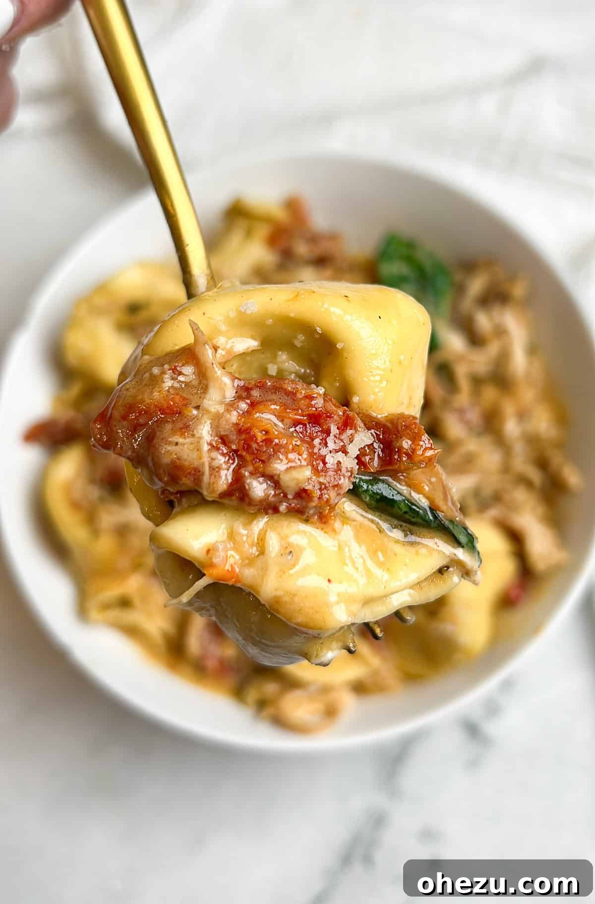 Decadent Slow Cooker Marry Me Tortellini with creamy sun-dried tomato sauce