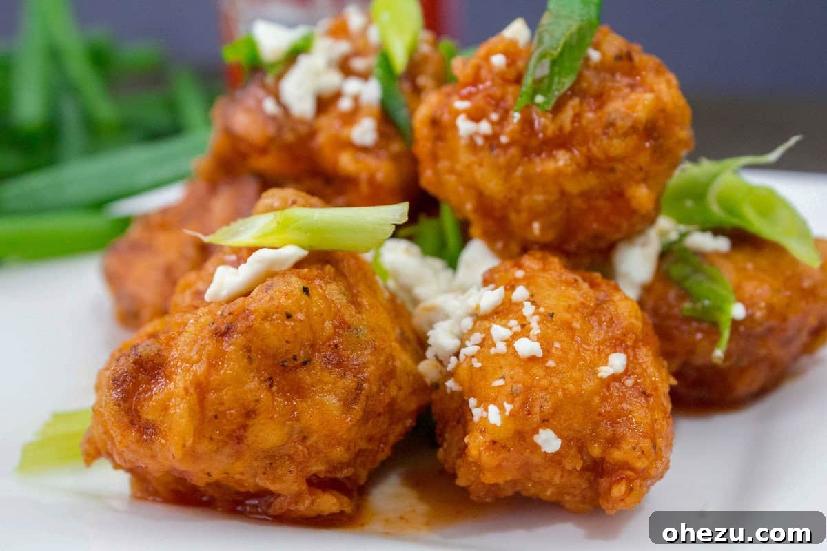 Crispy golden Buffalo Cauliflower Bites, served with a side of ranch or blue cheese dip.
