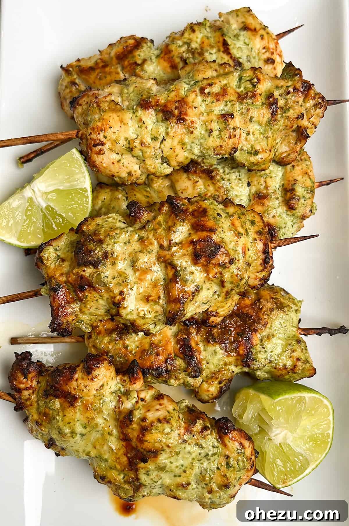 Zesty Cilantro Lime Air Fryer Chicken Skewers 4 A selection of fresh ingredients laid out: chicken pieces, Greek yogurt, cilantro, lime, garlic, and jalapeños.