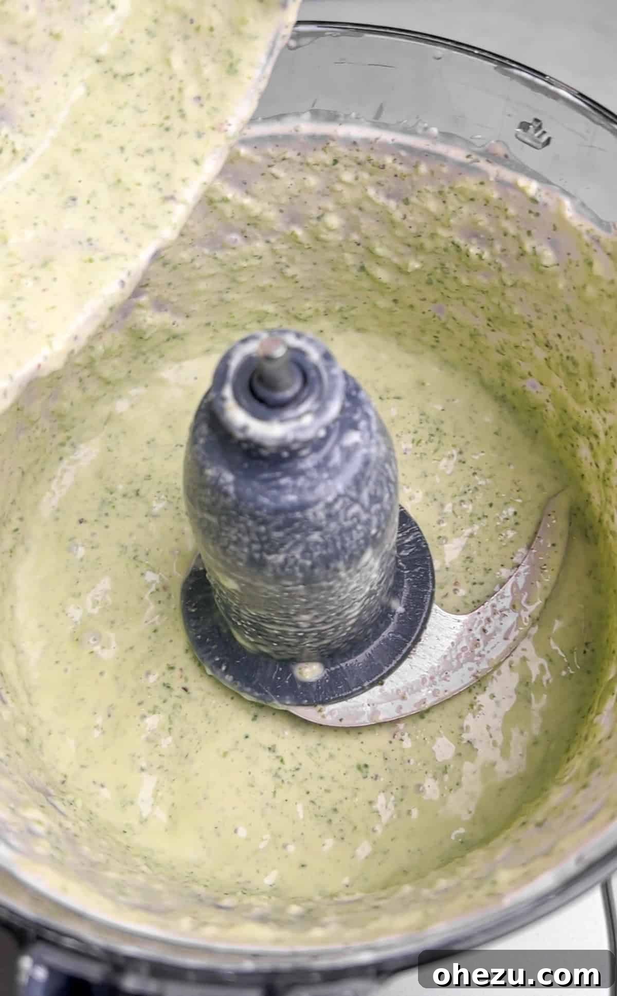 Zesty Cilantro Lime Air Fryer Chicken Skewers 5 Cilantro lime sauce being blended in a food processor, showing its smooth, vibrant green texture.