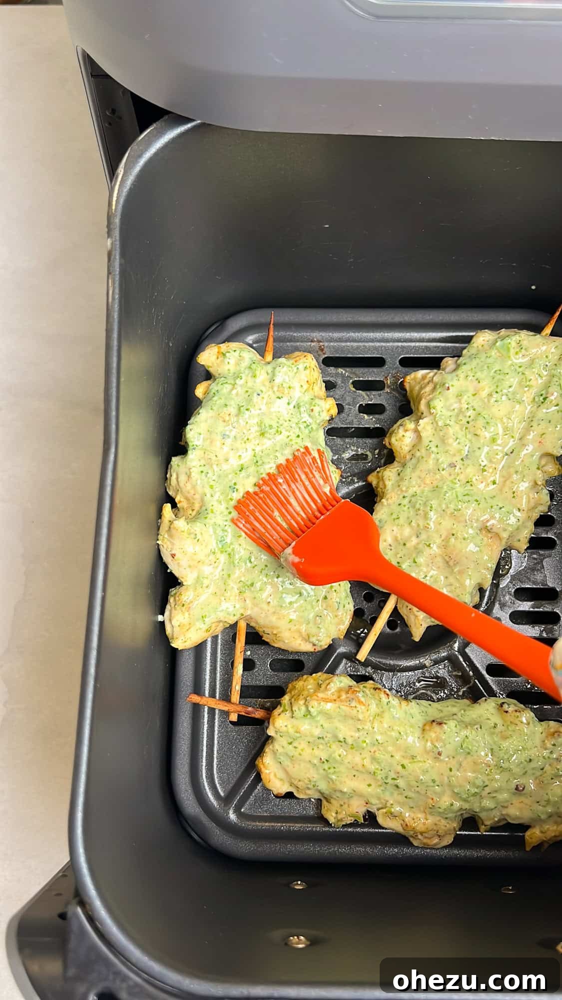 Zesty Cilantro Lime Air Fryer Chicken Skewers 7 Air fryer chicken skewers, beautifully basted in cilantro lime sauce, cooking to golden perfection.