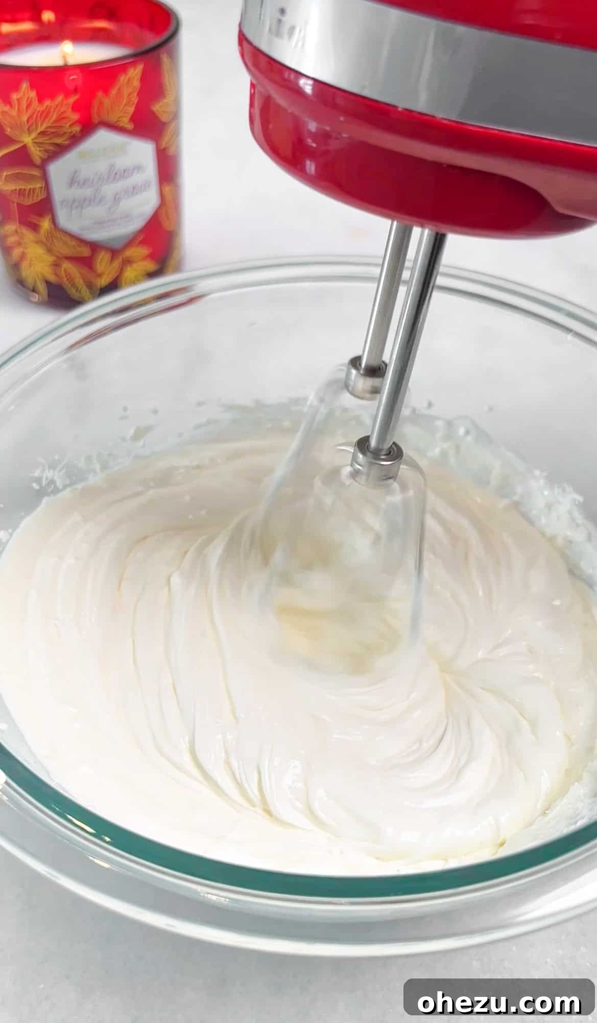Smooth, whipped cream cheese and sour cream mixture in a bowl, ready for other ingredients
