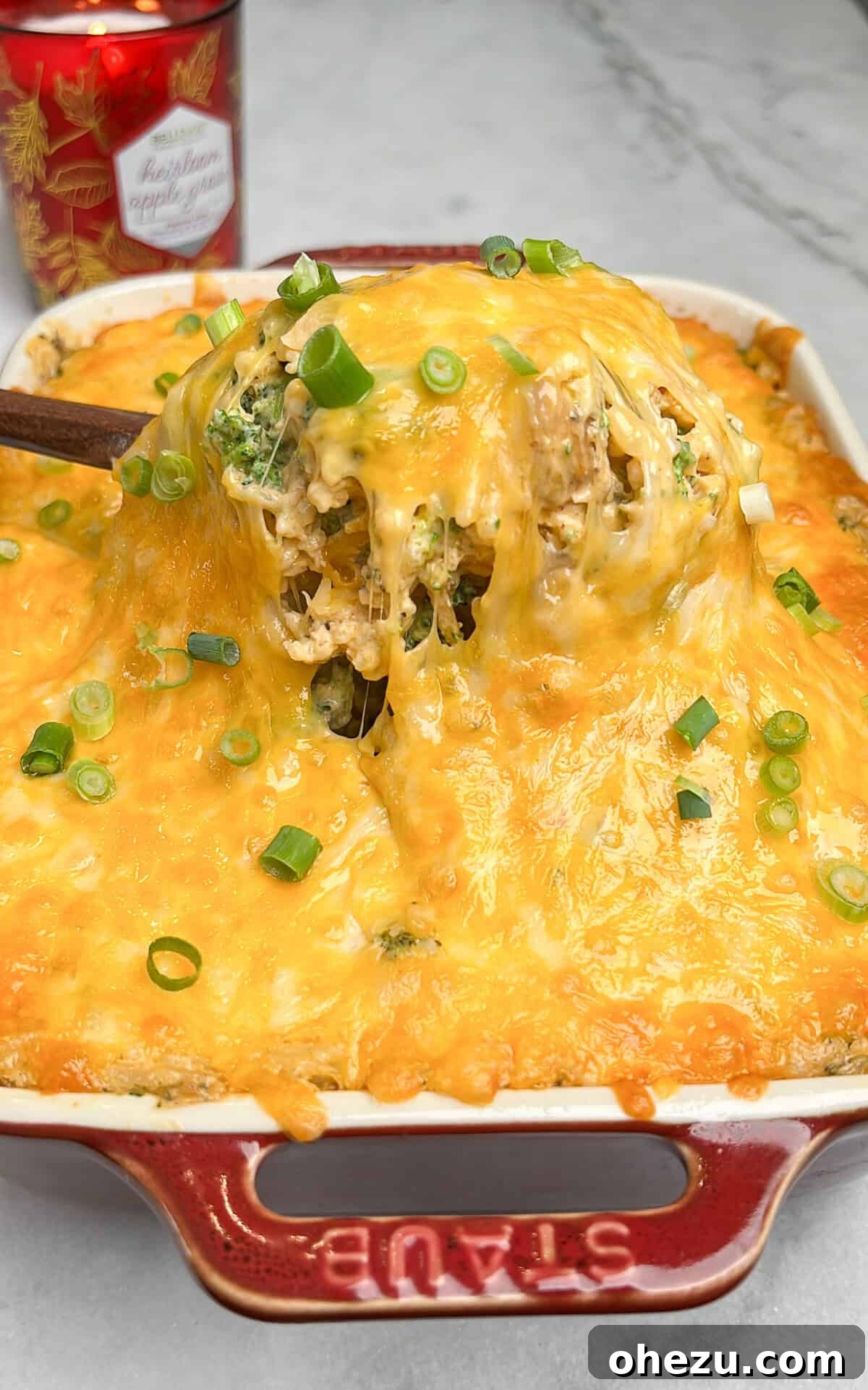 Golden Cheesy Chicken Broccoli Rice Bake 3 a close-up shot of creamy chicken broccoli rice casserole with melted cheese on top
