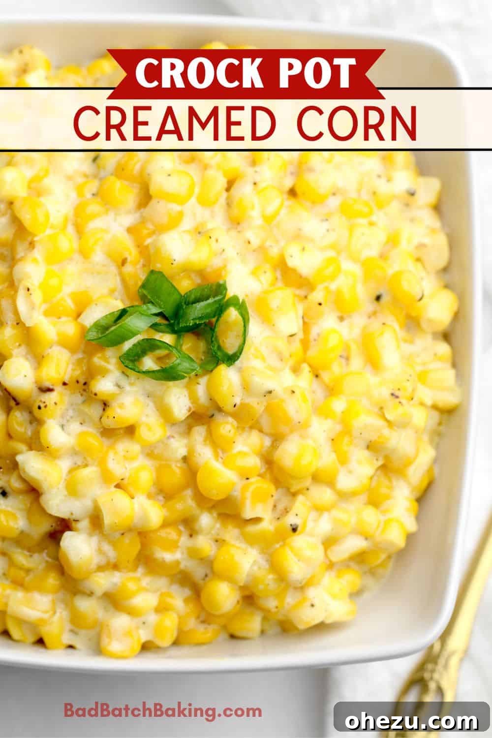 Creamed corn in a bowl garnished with fresh herbs