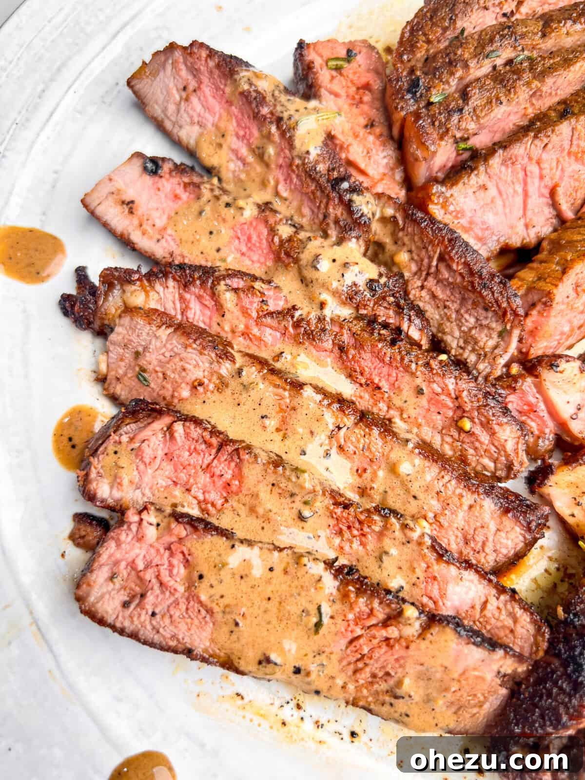 Cognac Kissed Cast Iron Steak 2 Perfectly seared cast iron steaks ready to be served.