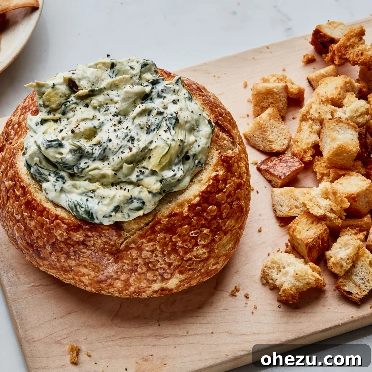 Over 70 Perfect Friendsgiving Recipes to Try in 2024 14 Classic Spinach Artichoke Dip in a Bread Bowl