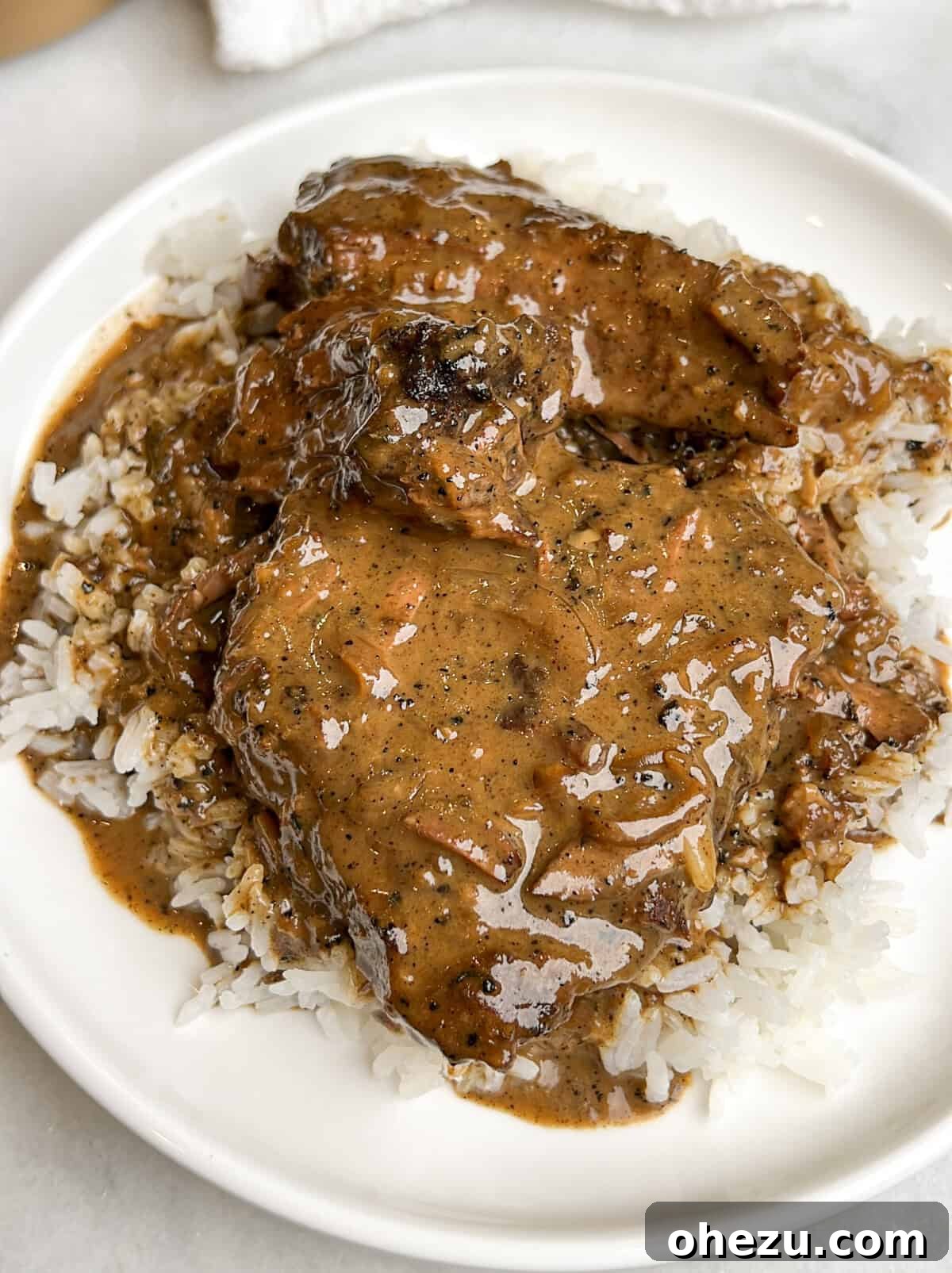 Over 70 Perfect Friendsgiving Recipes to Try in 2024 57 Southern Smothered Steak and Gravy over Rice