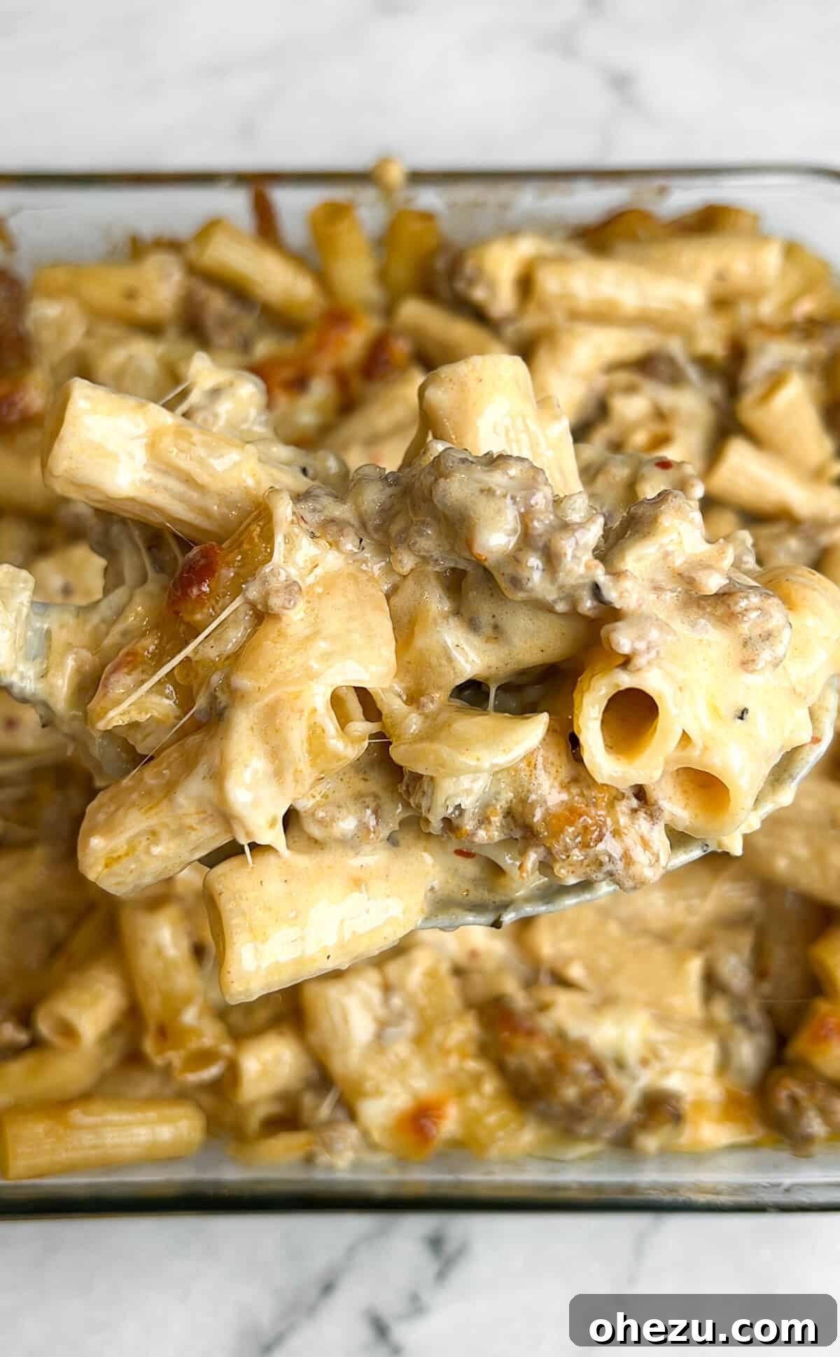 Over 70 Perfect Friendsgiving Recipes to Try in 2024 59 Bubbly Creamy Sausage Alfredo Bake with Rigatoni