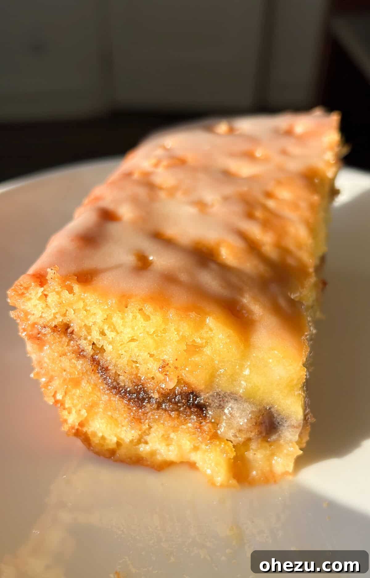A fully baked and glazed viral Honey Bun Cake