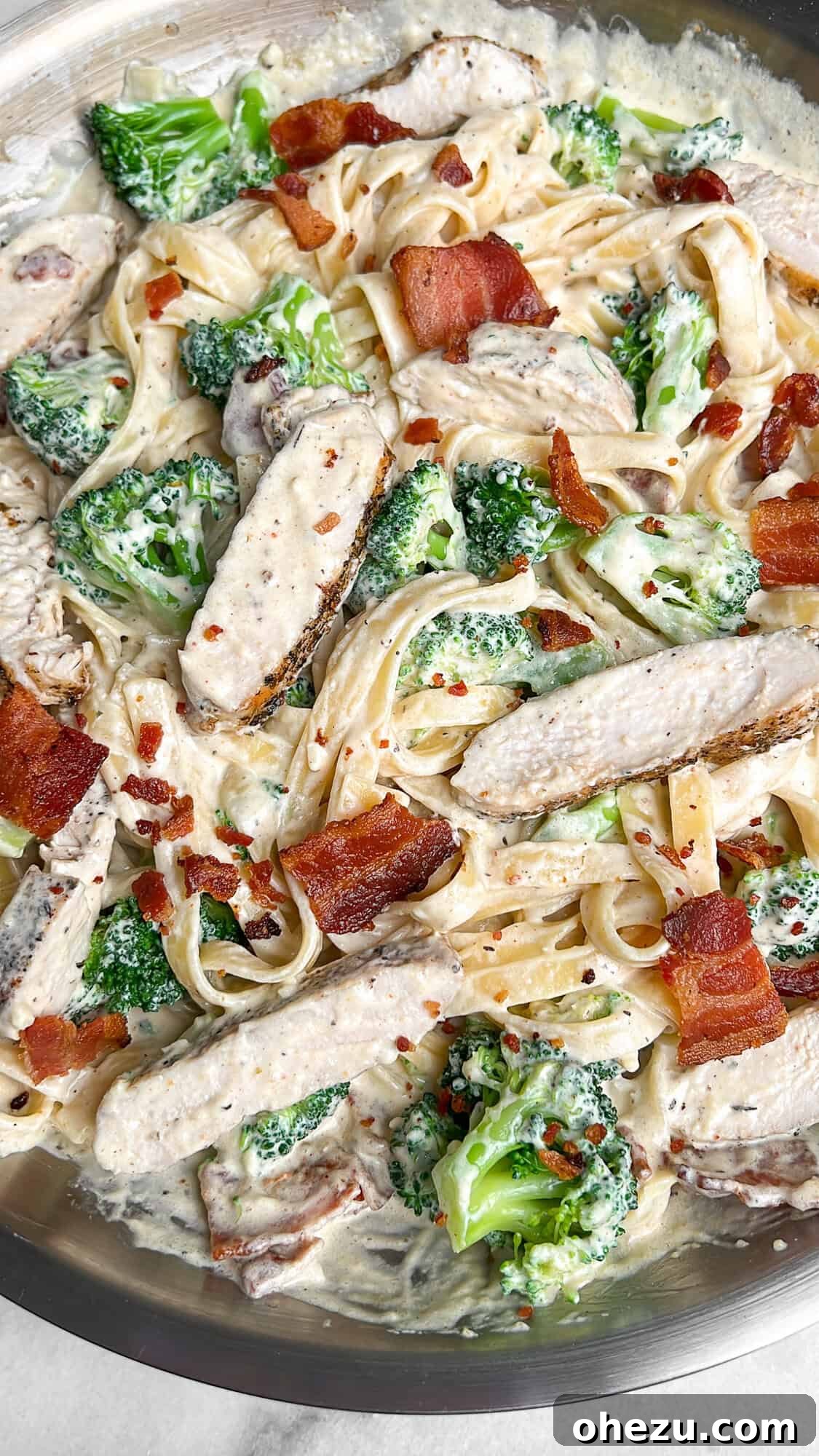 Golden Chicken & Crispy Bacon Broccoli Alfredo 4 Large skillet filled with chicken fettuccini alfredo