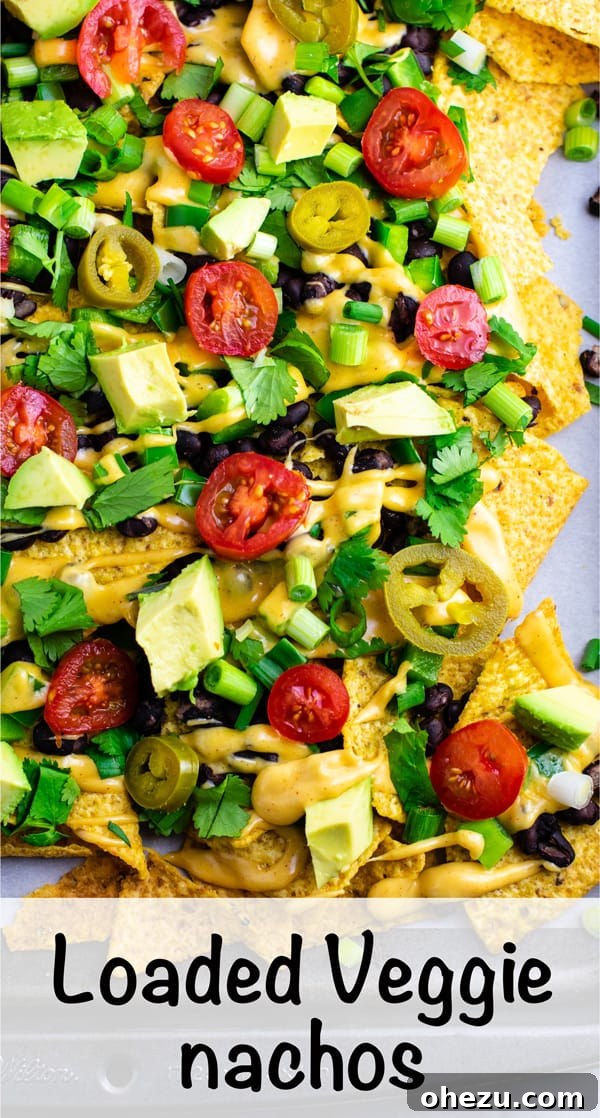 Ultimate Loaded Vegetable Nachos 9 A final close-up of the delicious loaded veggie nachos, emphasizing their inviting and mouth-watering appearance. #veggienachos #vegetarian #nachocheese #nachocheesesauce