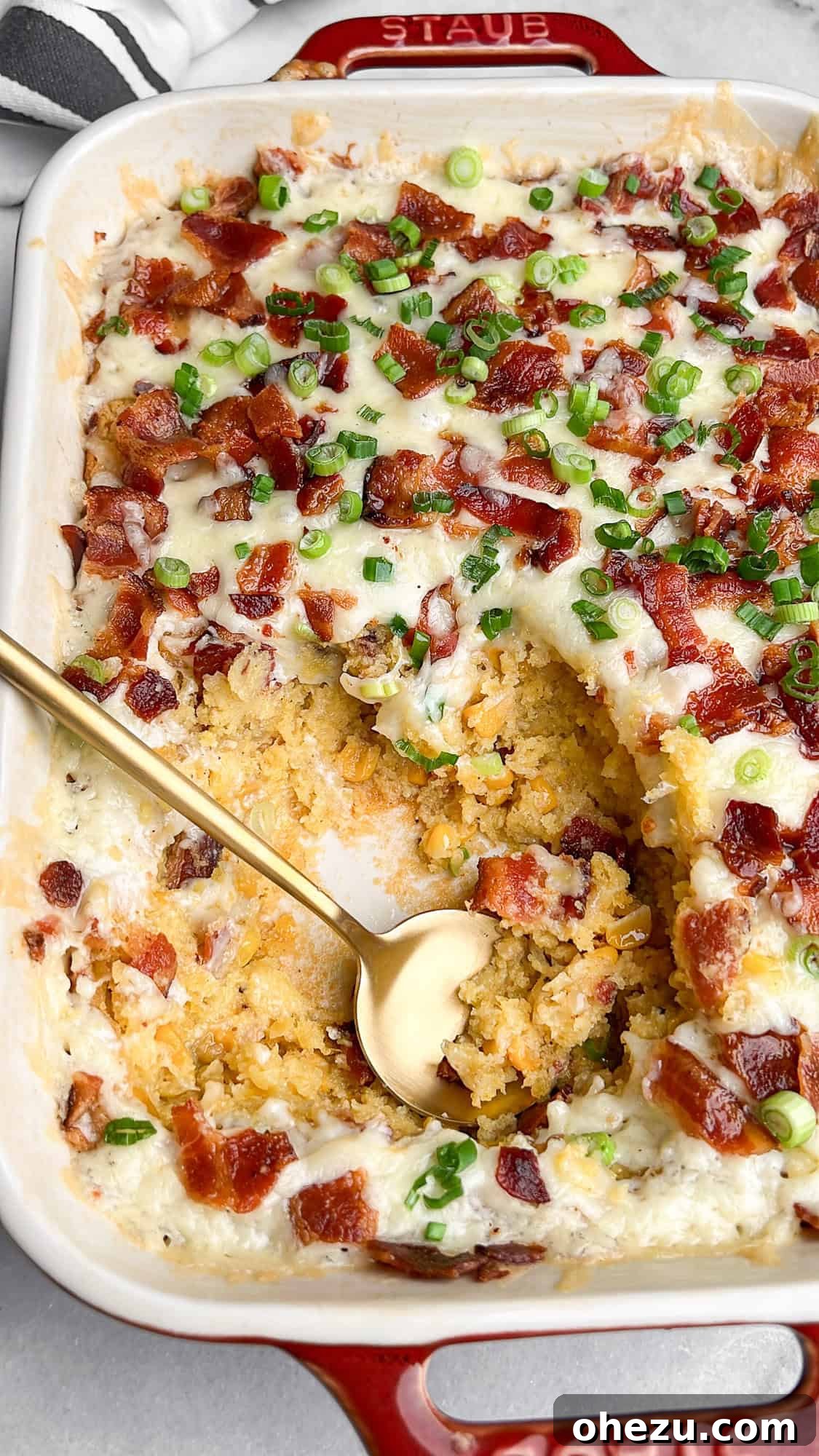 Deliciously moist loaded corn casserole in a baking pan, ready to serve for the holidays