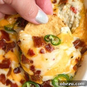Baked jalapeno chicken dip, golden and bubbly in a baking dish