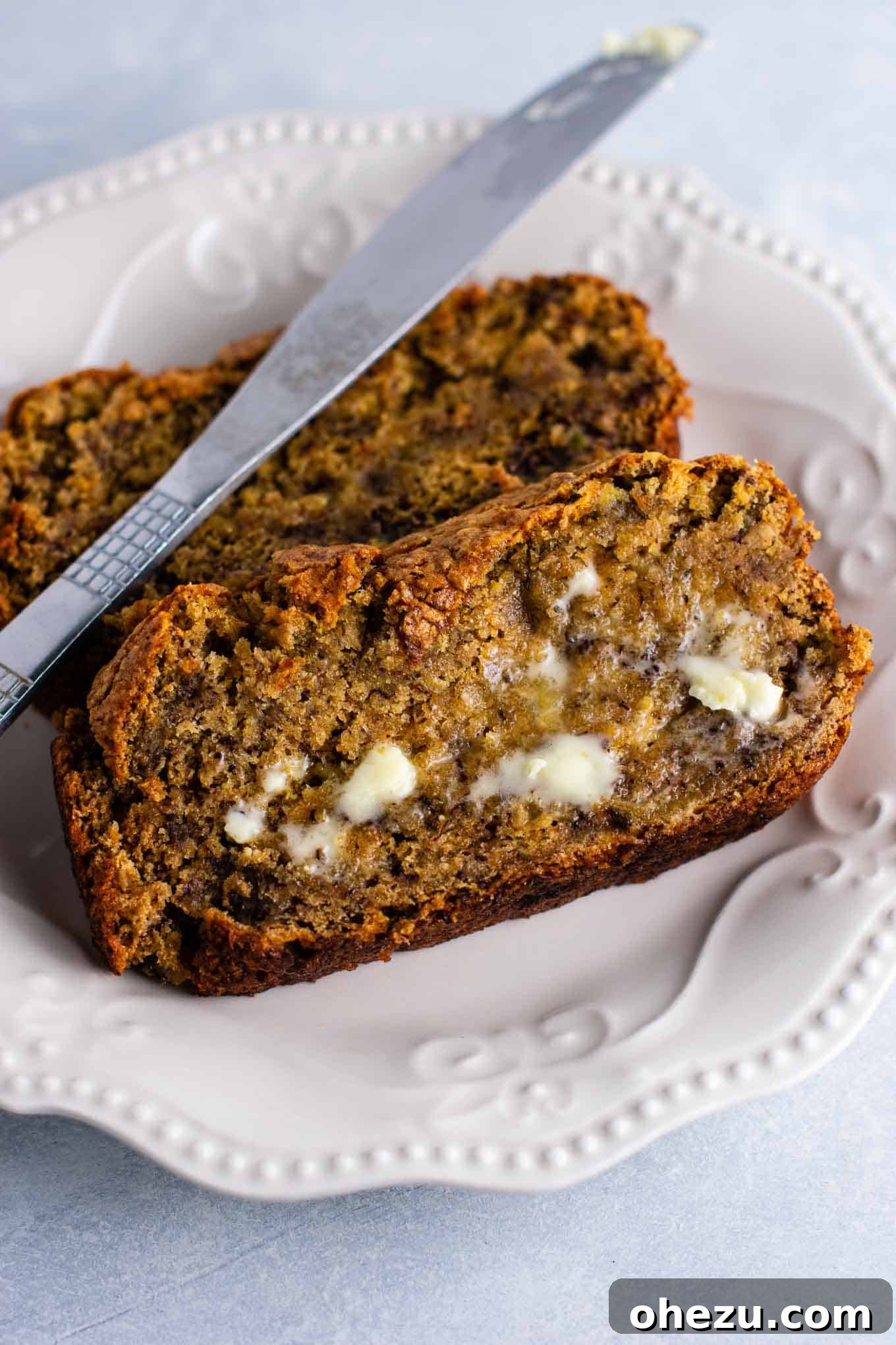 Ultimate Vegan Banana Bread 5 A vibrant flat lay showcasing slices of vegan banana bread, accompanied by a cup of instant iced coffee, perfect for a delightful dairy-free and egg-free breakfast or brunch.