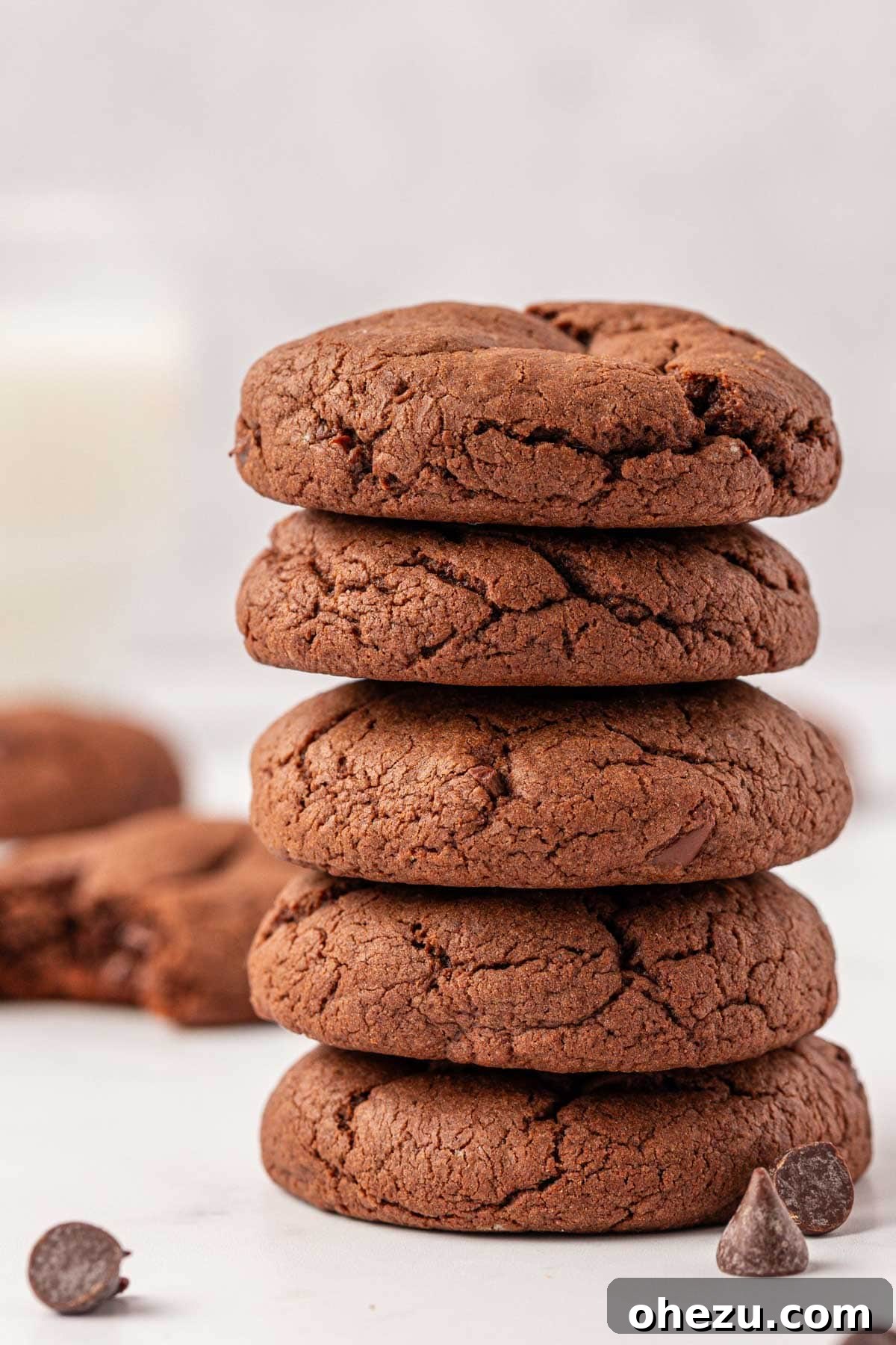 Irresistible Chocolate Cake Mix Cookies 2 Stacked fudgy chocolate cake mix cookies with visible chocolate chips
