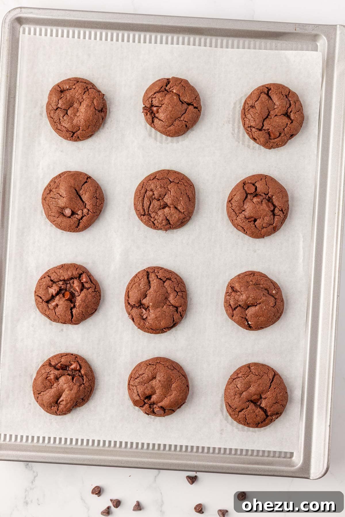 Irresistible Chocolate Cake Mix Cookies 11 Freshly baked chocolate cake mix cookies on a baking sheet, just out of the oven