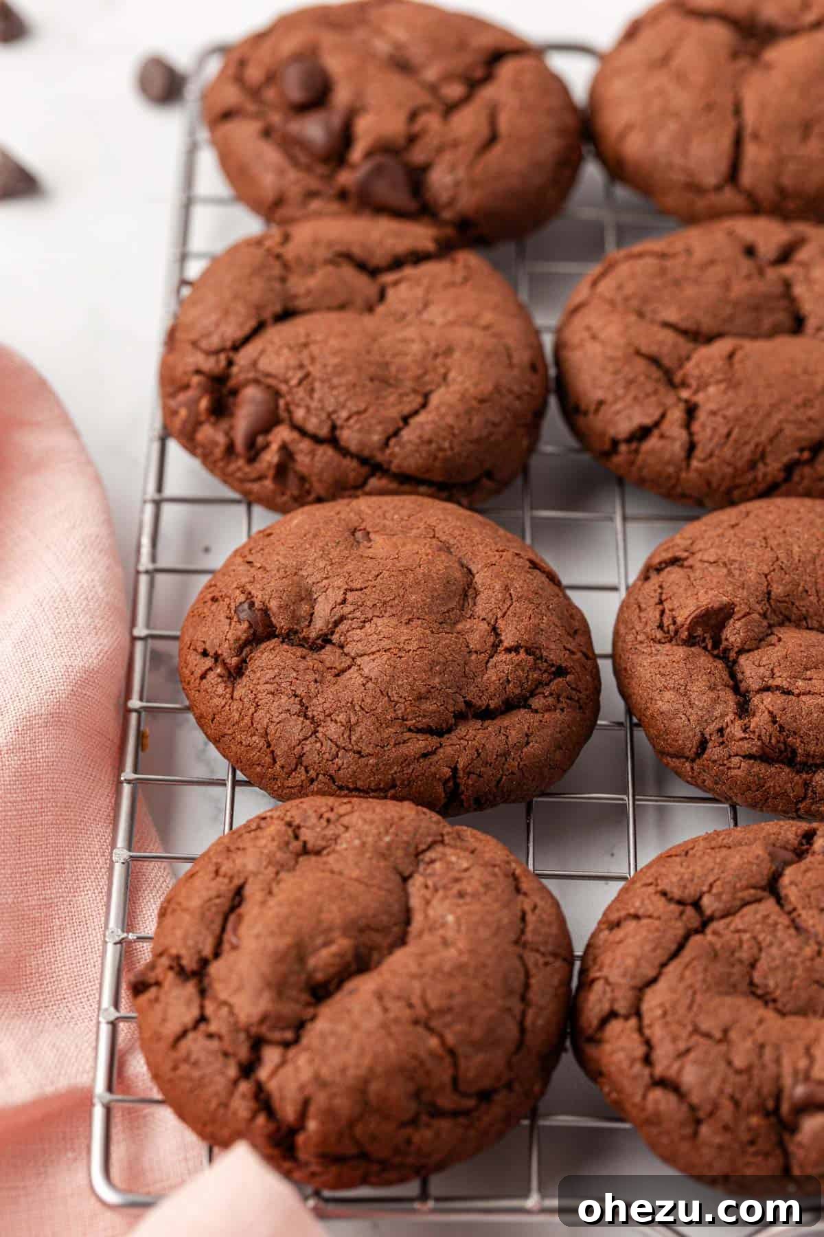 Irresistible Chocolate Cake Mix Cookies 3 Freshly baked chocolate cake mix cookies cooling on a metal wire rack