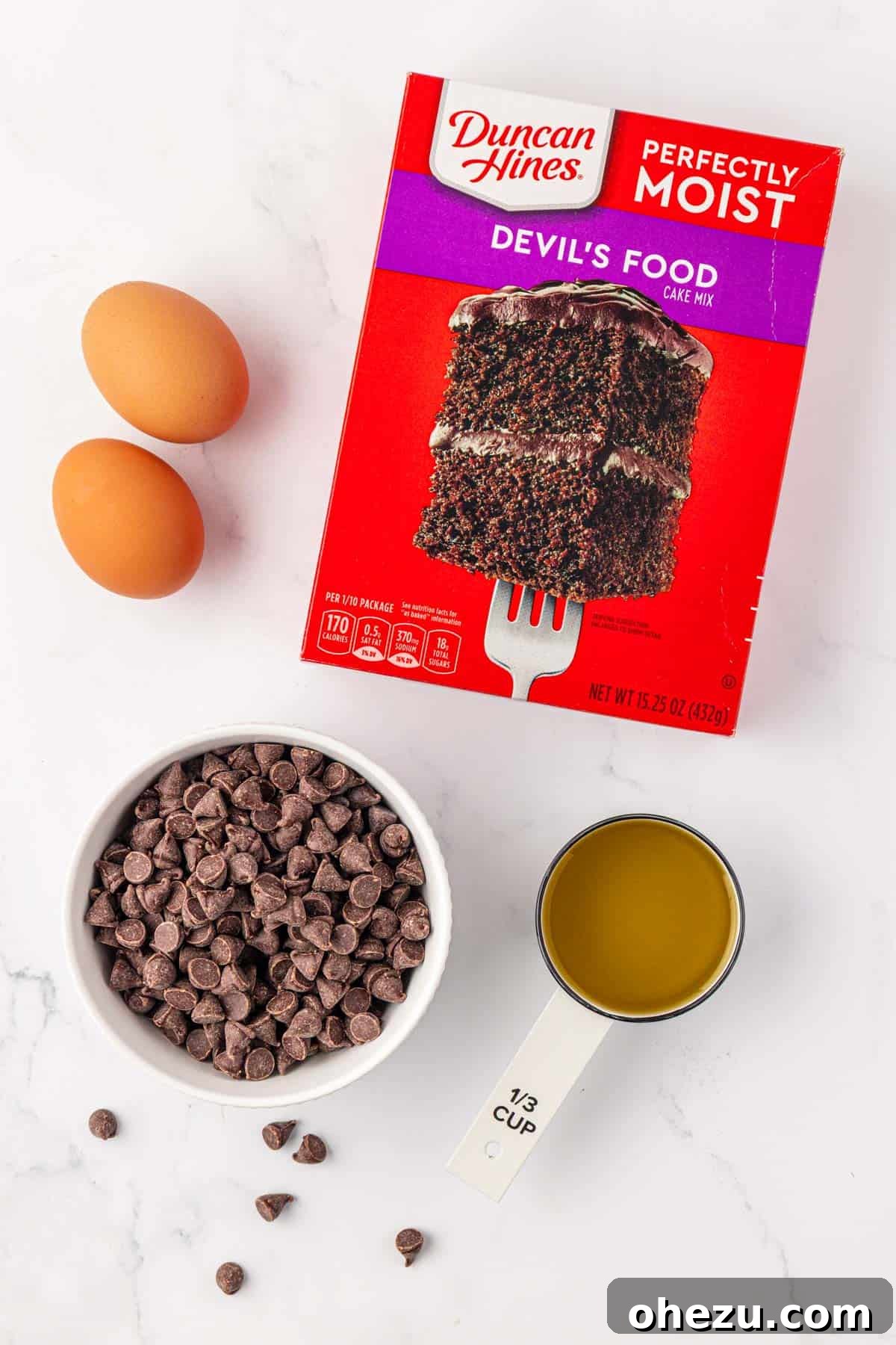 Irresistible Chocolate Cake Mix Cookies 4 Essential ingredients laid out on a table, ready for baking chocolate cake mix cookies