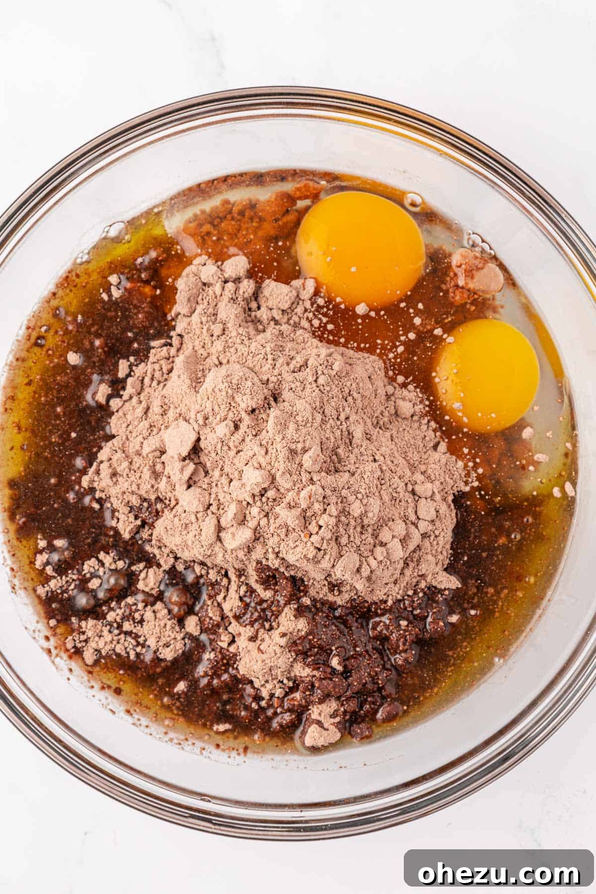 Irresistible Chocolate Cake Mix Cookies 5 Mixing bowl with chocolate cake mix, eggs, and oil before mixing