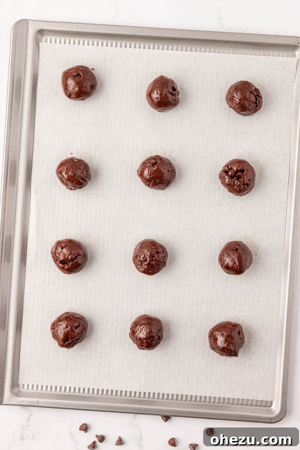 Irresistible Chocolate Cake Mix Cookies 10 Cookie dough balls rolled and placed on a baking sheet, ready for the oven