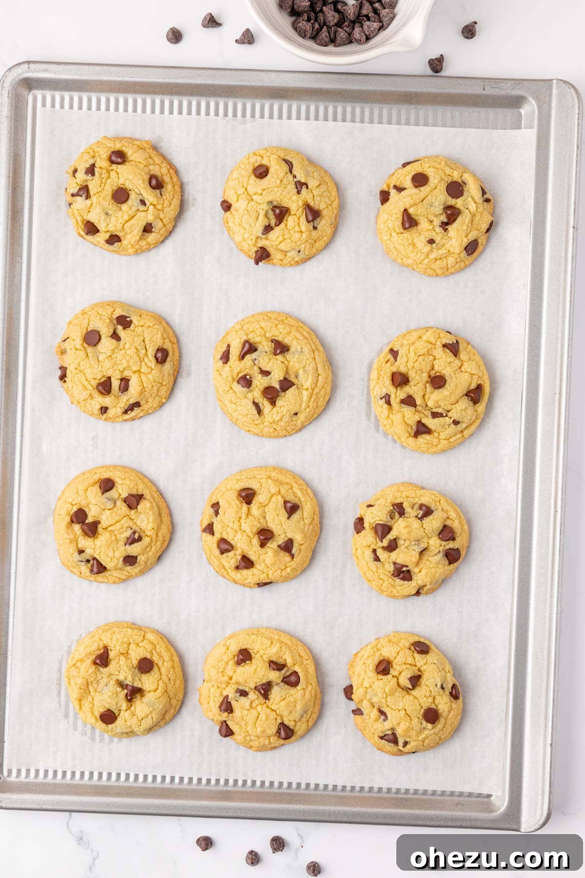 Freshly baked golden cake mix chocolate chip cookies on a cooling rack