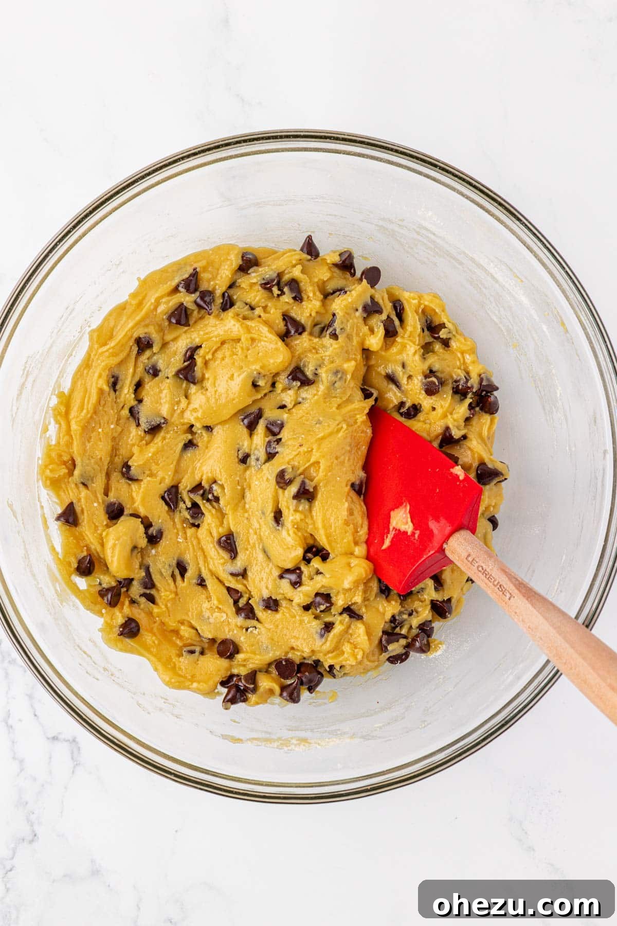 Completed cake mix cookie dough with chocolate chips evenly folded in
