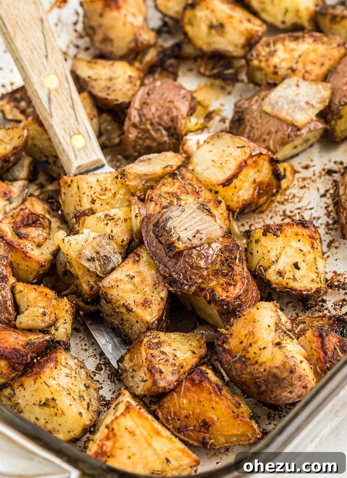 Easy roasted potatoes with onions served in a bowl