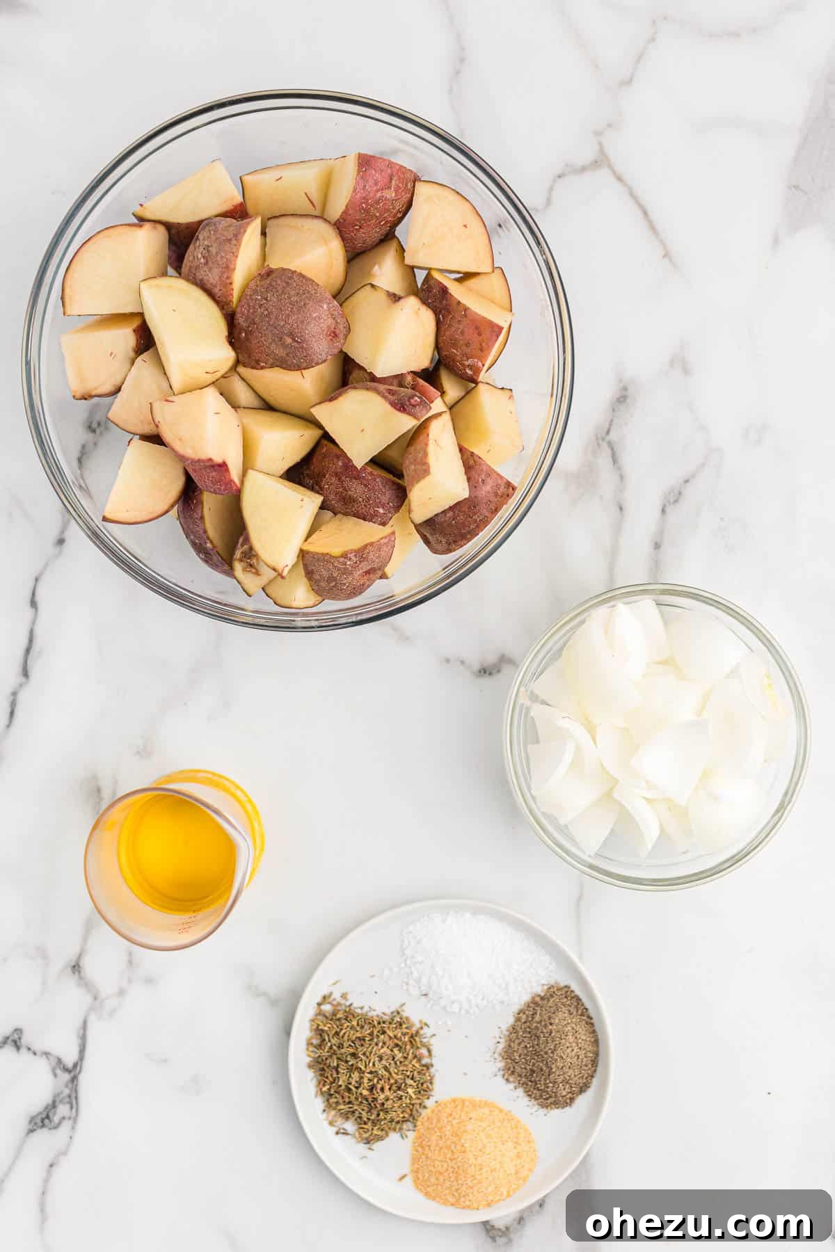 Ingredients laid out for oven-roasted potatoes and onions
