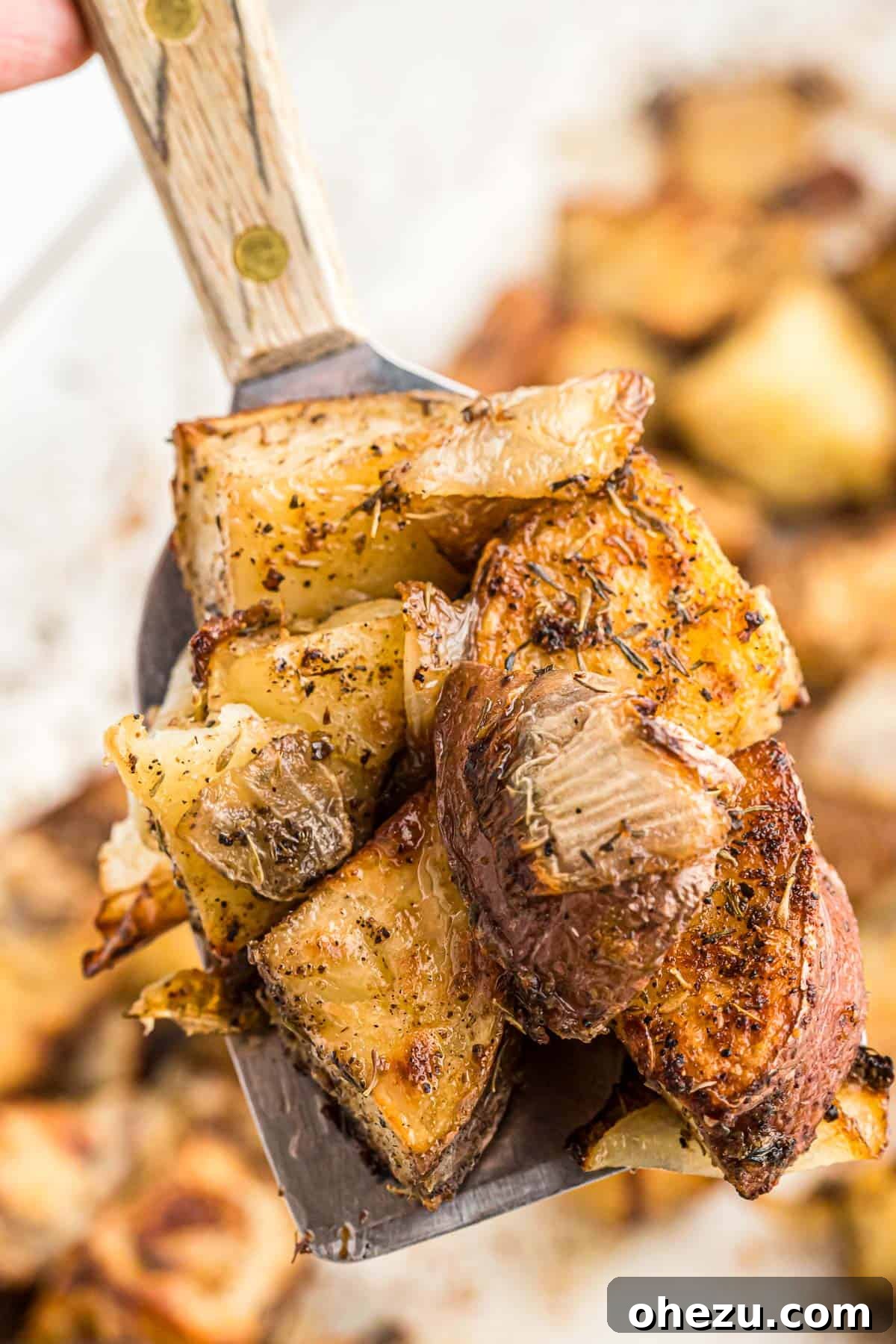 Easy roasted potatoes with onions ready for the oven