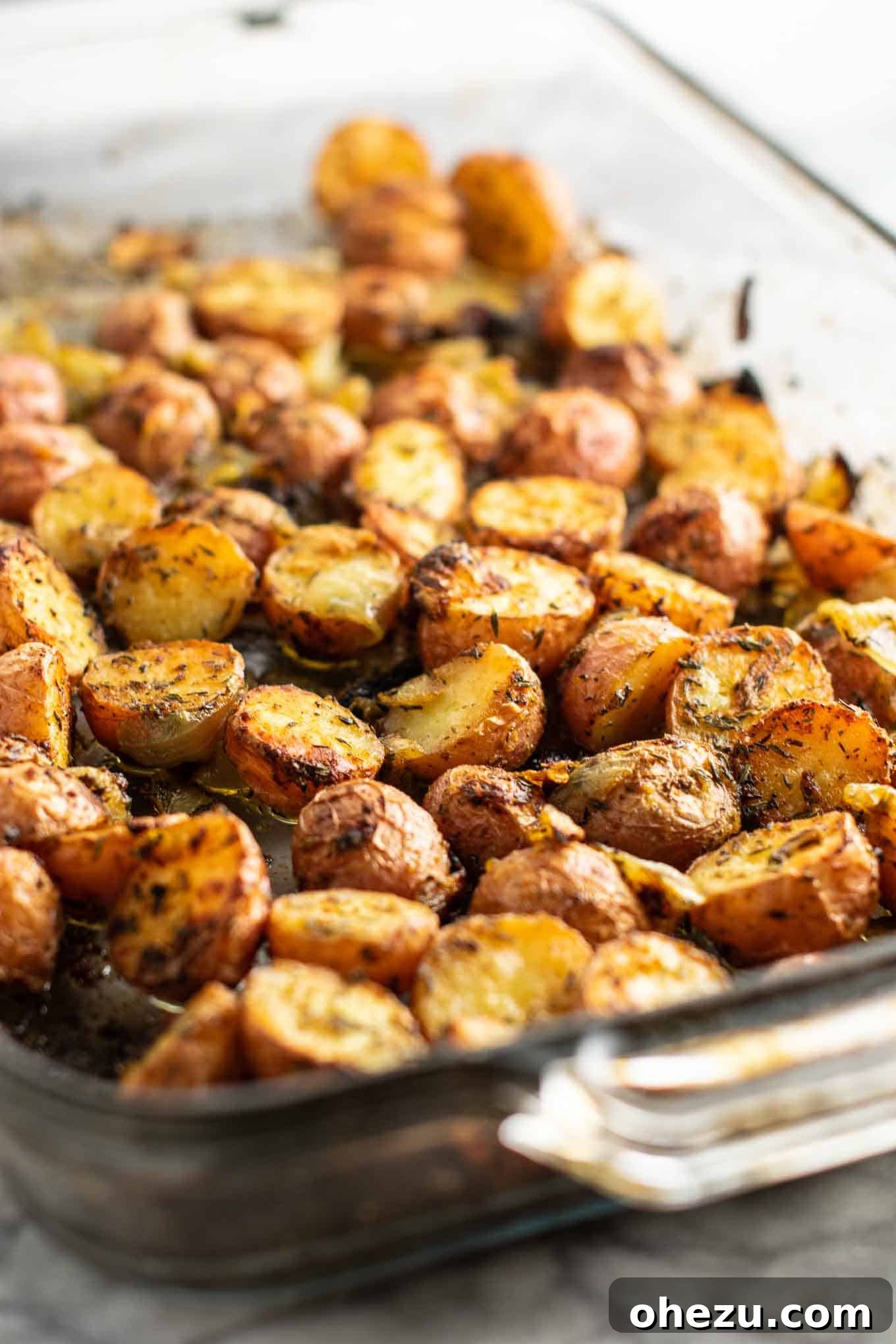 Finished plate of crispy roasted potatoes and onions side dish