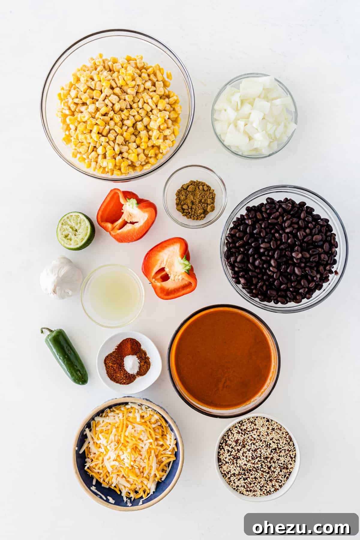 the ingredients for the quinoa casserole lined up on a white board