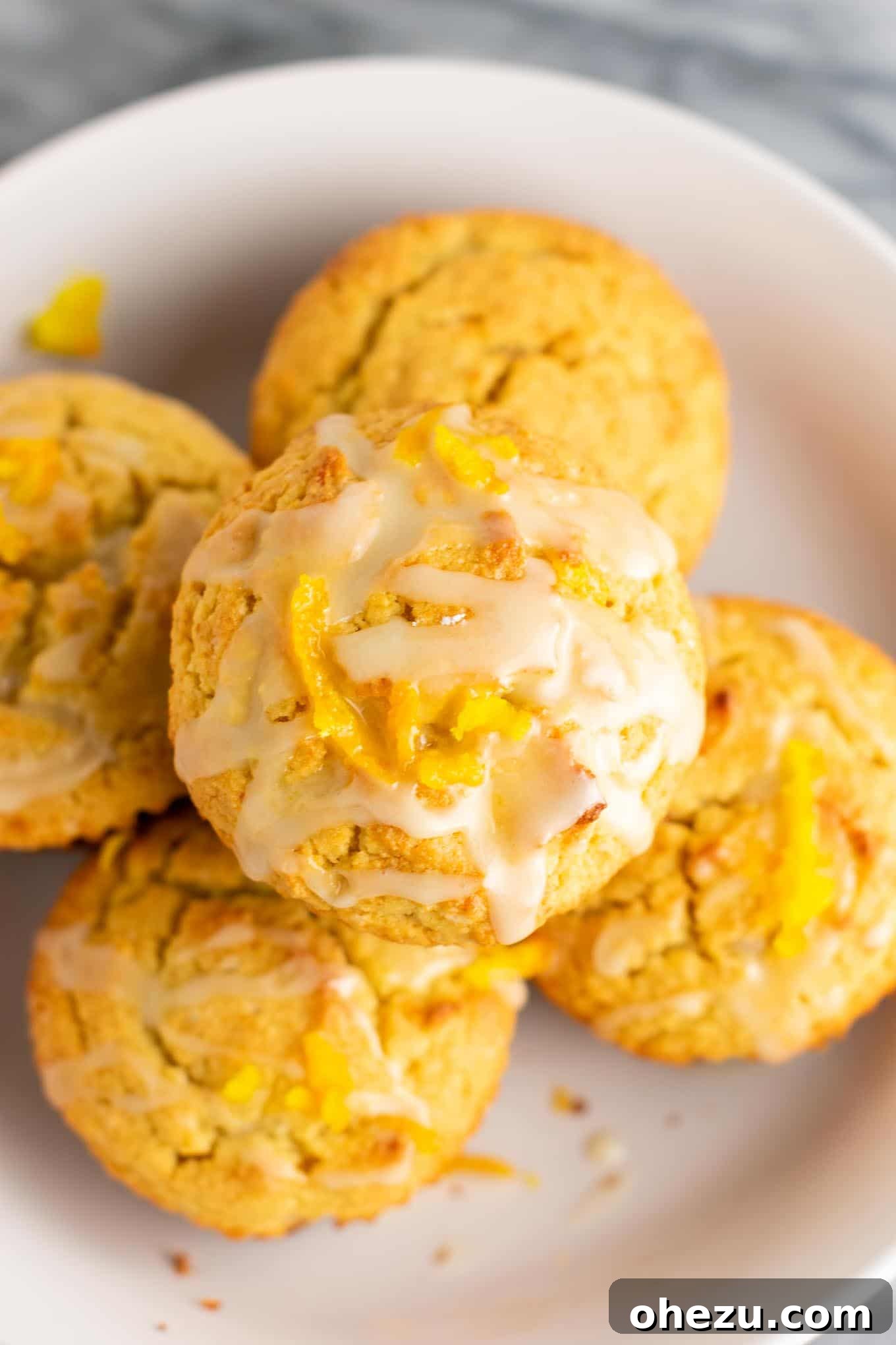 A close-up of gluten-free orange muffin batter with fresh orange zest visible