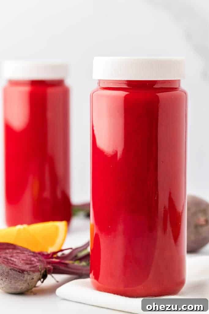 beet and carrot juice in a storage glass with a lid