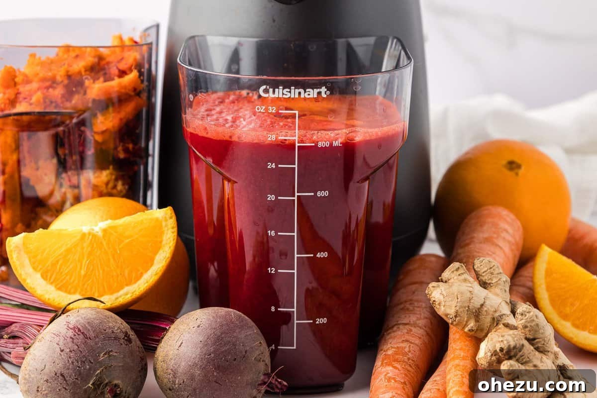 beet and carrot juice in the juicing canister
