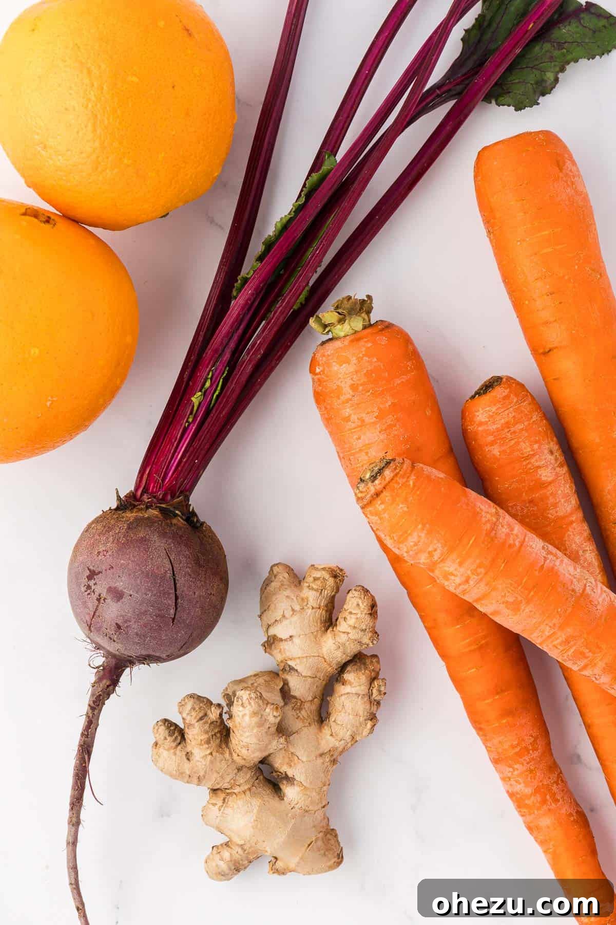 carrots, oranges, beet, and ginger root