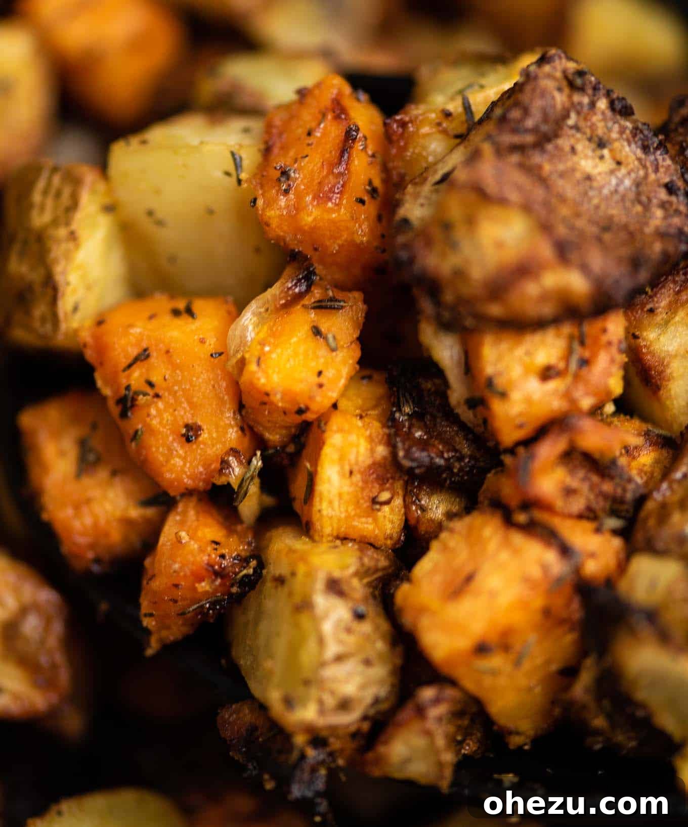 A close-up of air fried sweet potatoes and russet potatoes, perfectly golden and seasoned.