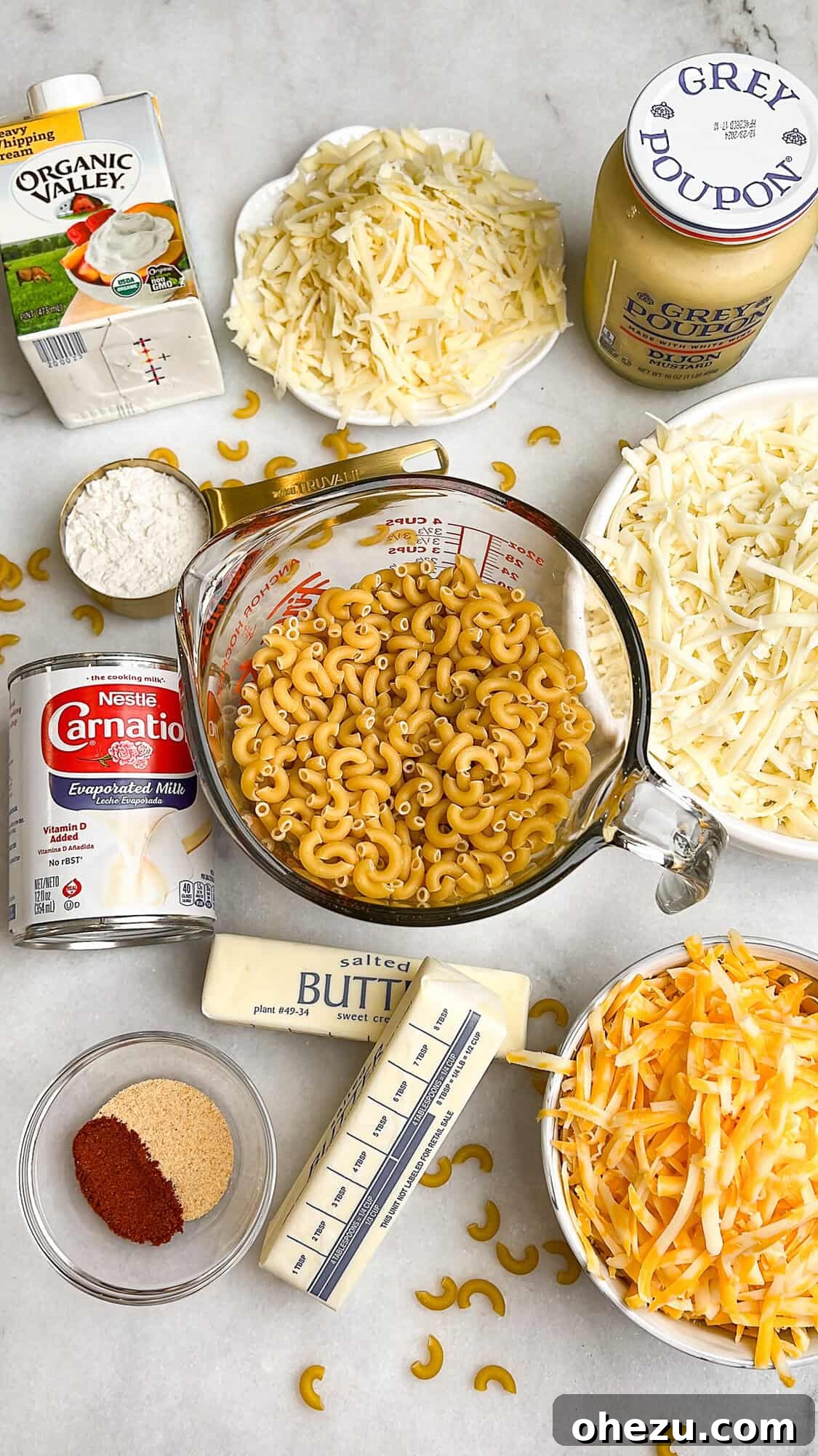 All ingredients precisely measured and arranged on a counter, ready for making Tini's mac and cheese.