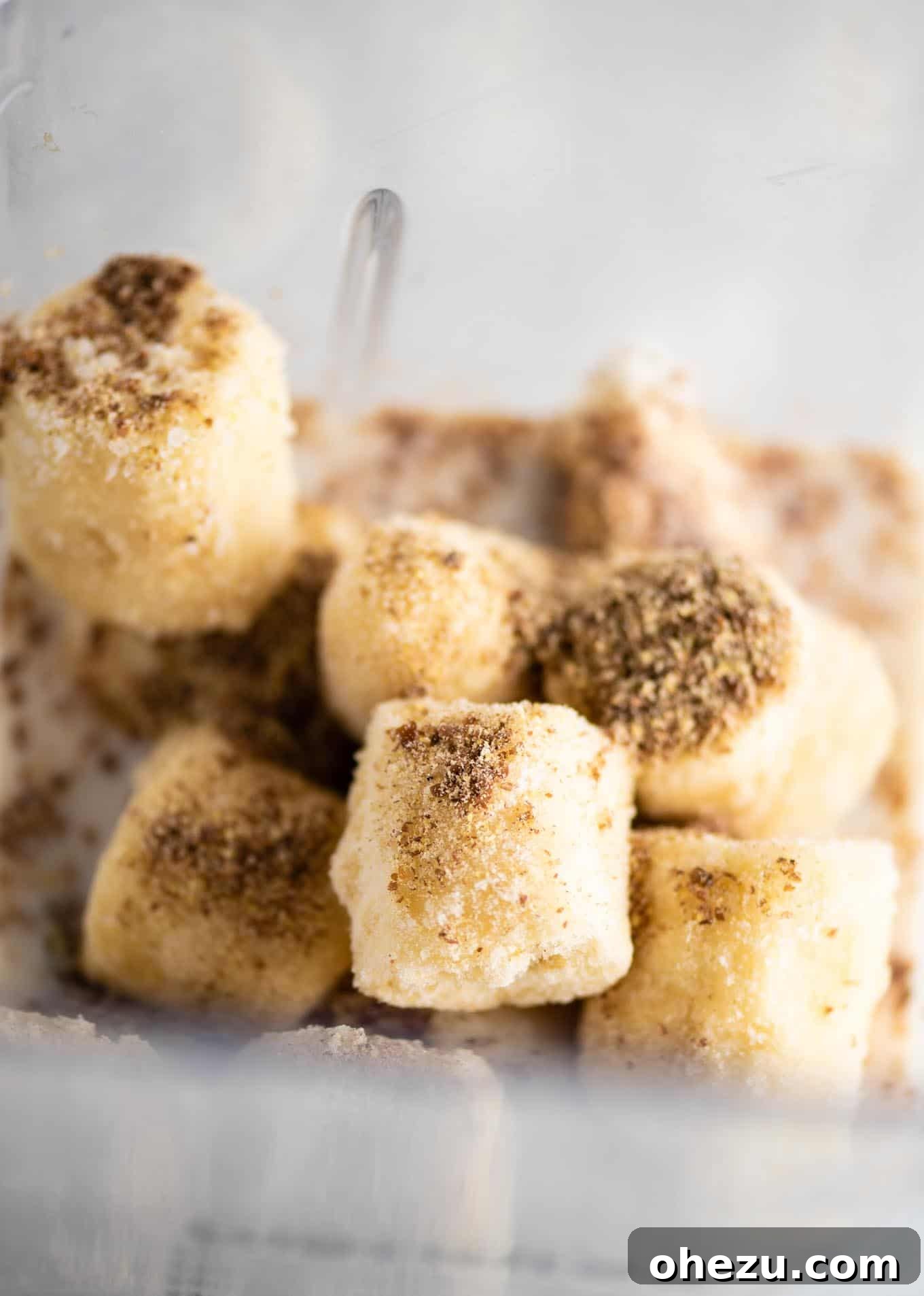 Banana Bliss 3 A blender filled with frozen banana chunks and ground flax seeds, showing the key ingredients before blending into a smoothie.