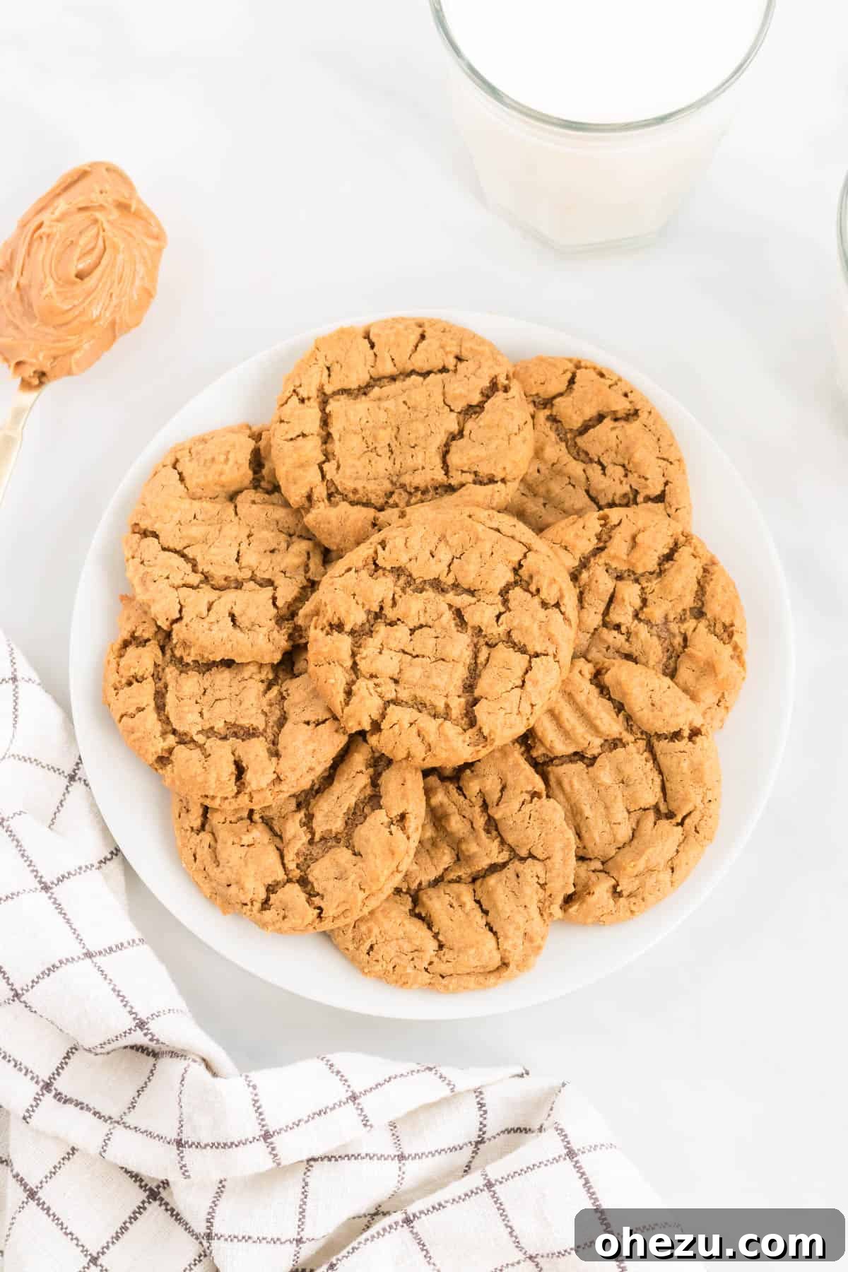 Gluten-Free Peanut Butter Cookies 2 Gluten-free peanut butter cookies neatly arranged on a white plate