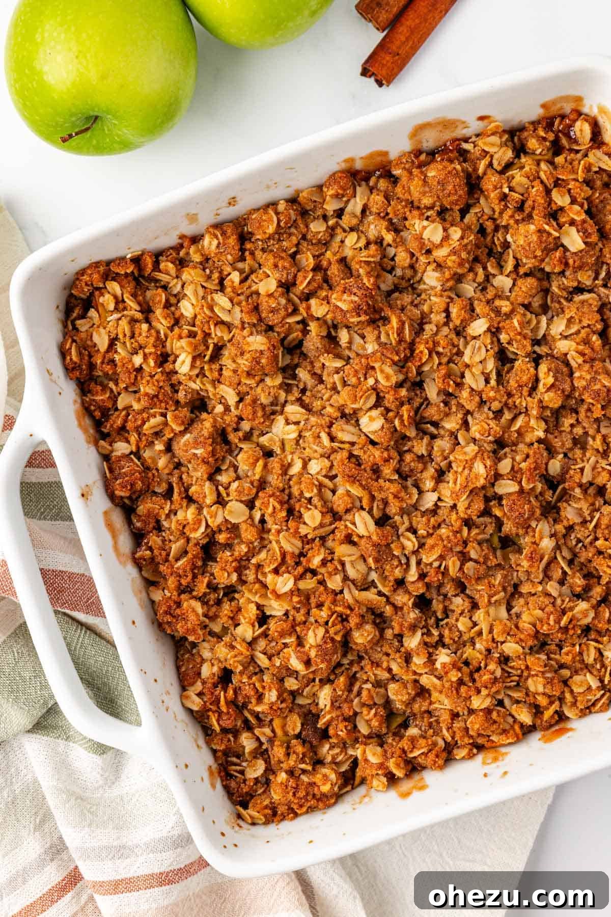 Heavenly Gluten-Free Apple Crumble 12 A close-up of the baked gluten-free apple crisp, showcasing its golden-brown, crunchy topping and the caramelized edges.