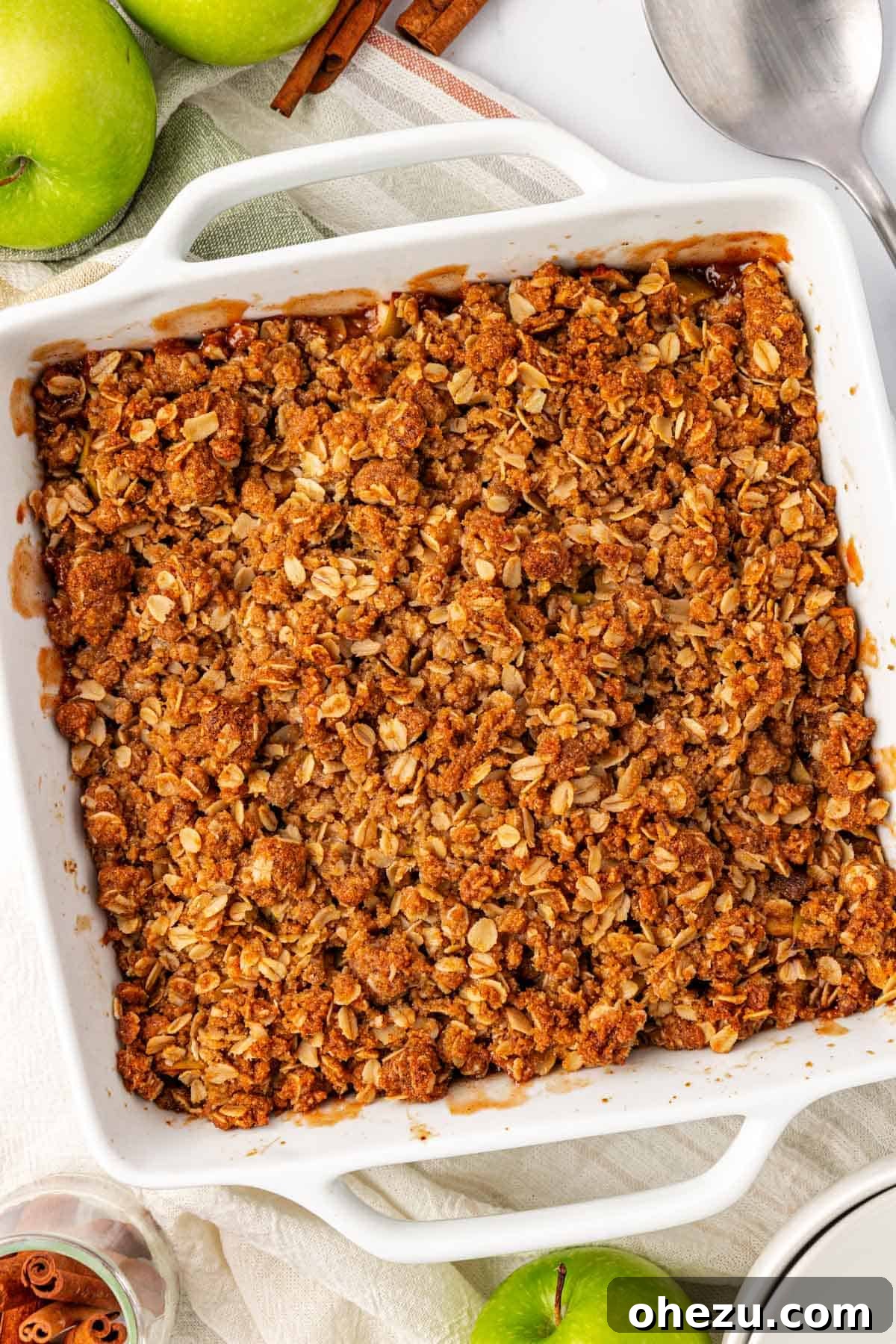 Heavenly Gluten-Free Apple Crumble 13 A close-up view of a perfectly baked gluten-free apple crisp, with a rich, golden-brown topping and soft, cooked apples visible.