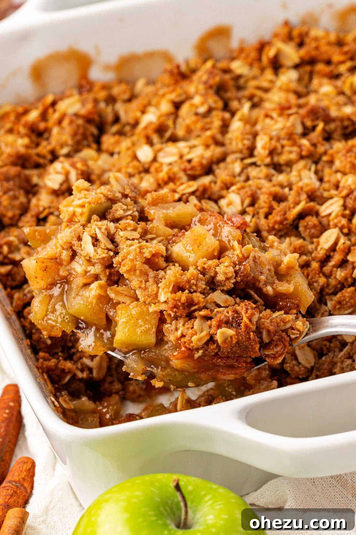 Heavenly Gluten-Free Apple Crumble 3 Close-up of a freshly baked gluten-free apple crisp, showing the crunchy oat topping and the rich, bubbly apple layer beneath.