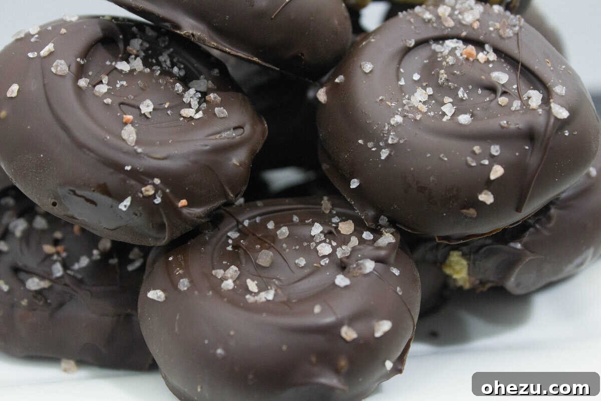 Decadent Sea Salt Dark Chocolate Peanut Butter Drops 5 Finished Salted Dark Chocolate Peanut Butter Patties on parchment paper