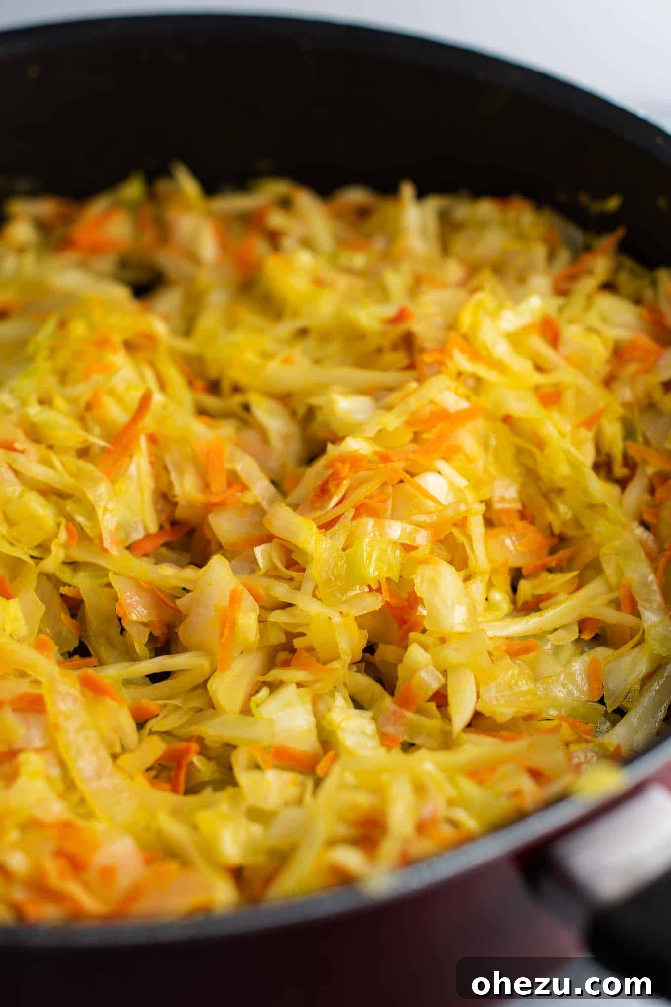The harmonious blend of cooked cabbage, carrots, onion, and ginger, now ready for the final additions.